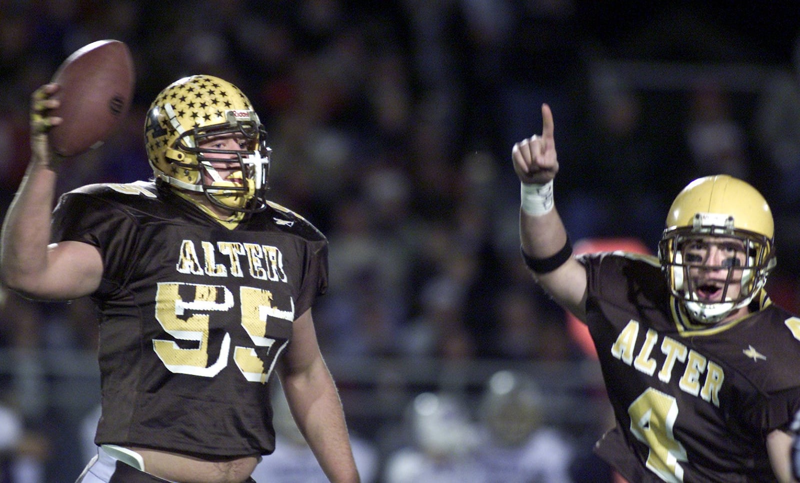 Nick Mangold (55) celebrates recovering a first quarter fumble with teammate John Sweeney. Alter played St. Francis Desles in a division III semifinal football game.