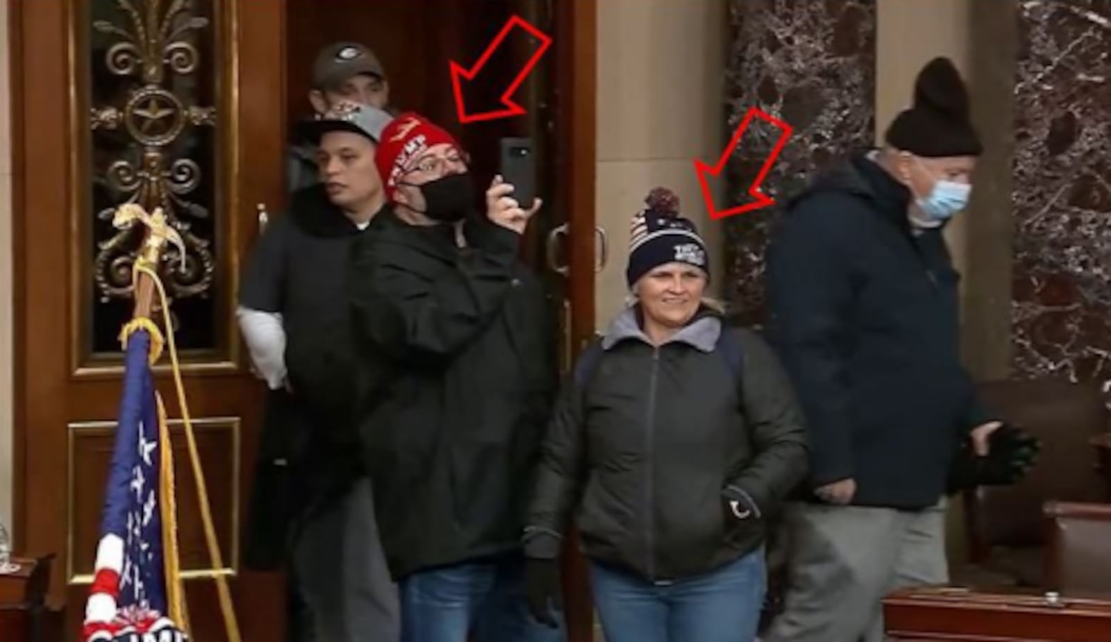 Shawndale Chilcoat (black beanie) and Donald Chilcoat (red beanie), shown in Capitol building security footage entering the Senate chambers. The photo was included in a federal criminal complaint filed with the U.S. District Court for the District of Columbia.