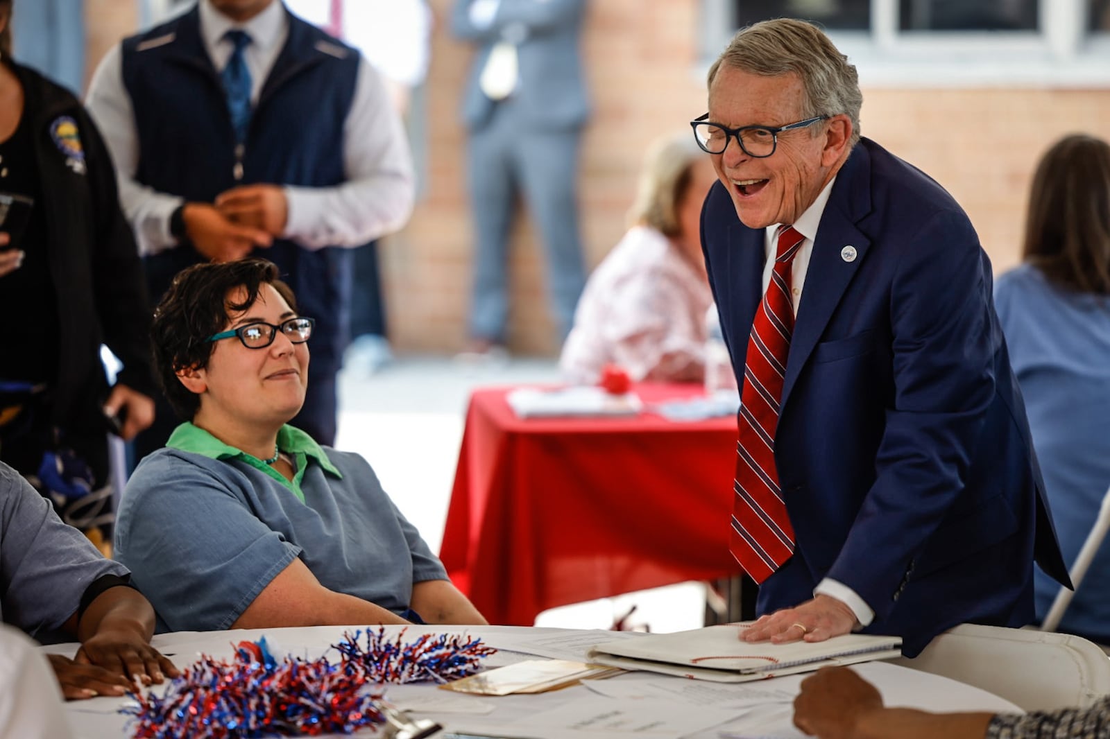 Ohio Gov. Mike DeWine greets Dayton Correctional Institution inmate, Allie Angelo, from Akron before announcing a new initiative to train inmates to build the infrastructure necessary for broadband expansion throughout the state. The event was held at Dayton Correctional Institution Tuesday morning May 23, 2023. JIM NOELKER/STAFF