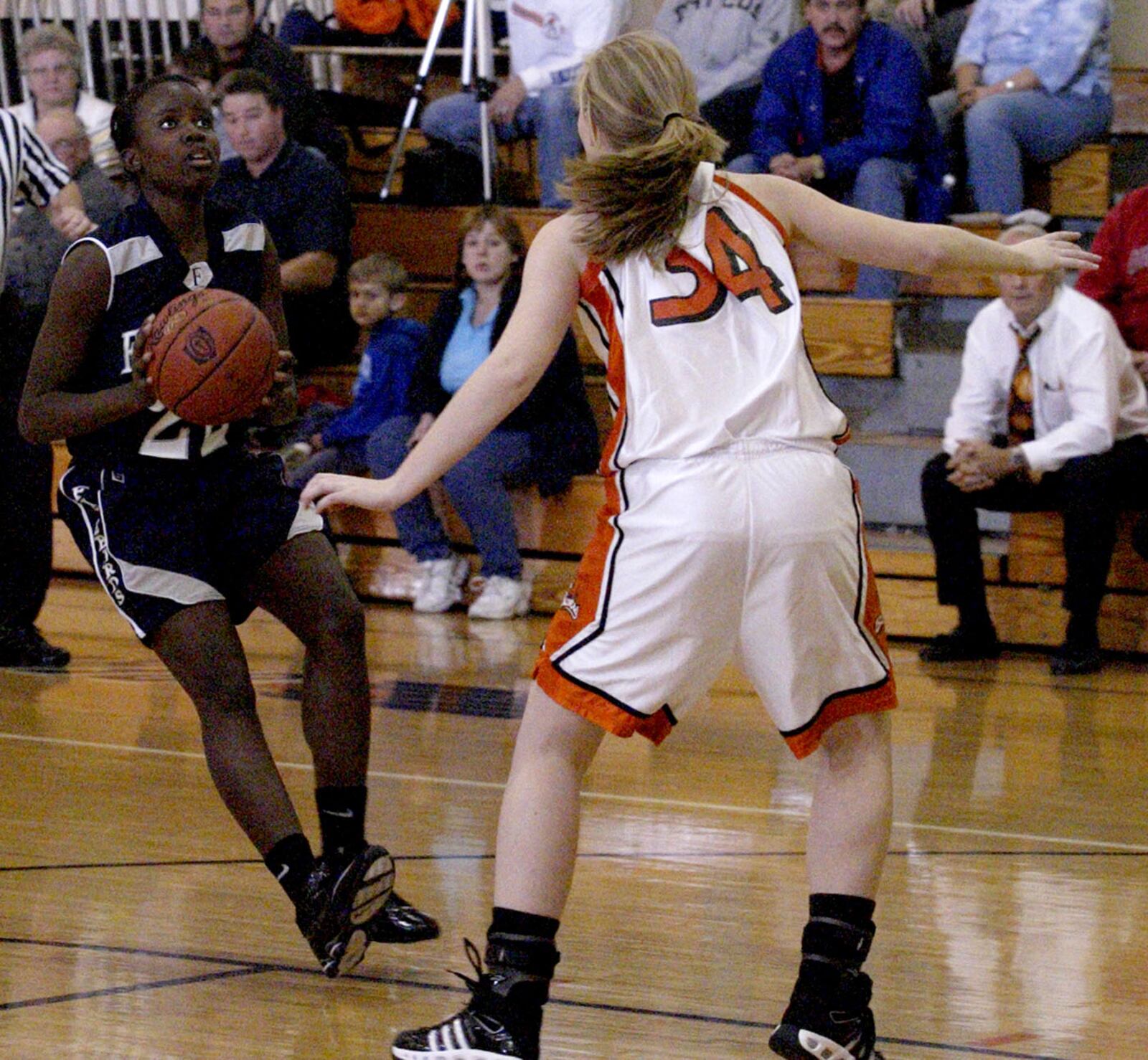 Guarded by Beavercreek's Sara Koclan (34) Fairmont's Brianna Welch (22) looks to shoot as the Fairmont Firebirds play the Beavercreek High School in 2007. DDN FILE PHOTO