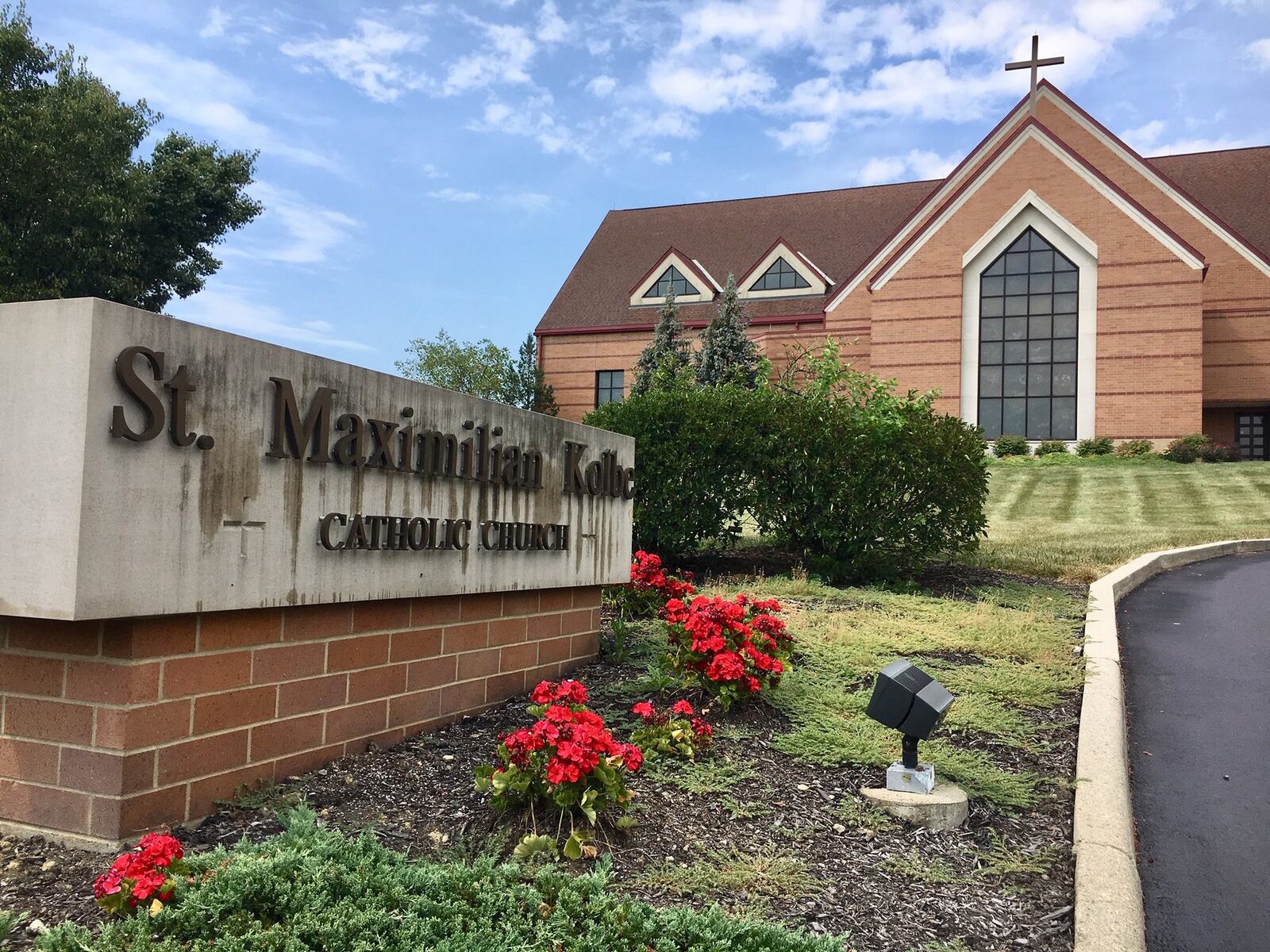 Hundreds of parishioners came to the St. Maximillian Kolbe Catholic Church in Liberty Twp. on Tuesday evening to hear the leader of the Cincinnati Archdiocese explain why a longtime pastor of the church was recently suspended. Members nearly filled every pew in the massive church with many lining up to question the handling of allegations against their former pastor, the Rev. Geoff Drew. (Photo by Michael D. Clark/Journal-News)