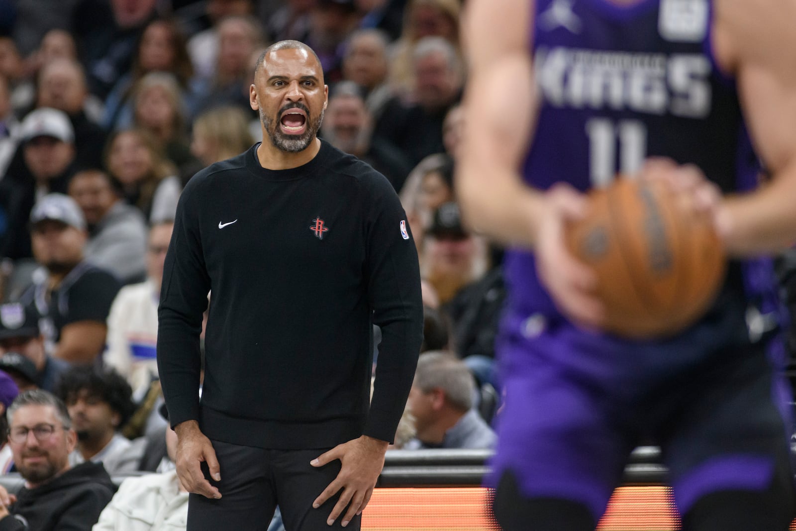 Houston Rockets head coach Ime Udoka shouts from the bench during the second half of an Emirates NBA Cup basketball game against the Sacramento Kings in Sacramento, Calif., Tuesday, Dec. 3, 2024. (AP Photo/Randall Benton)