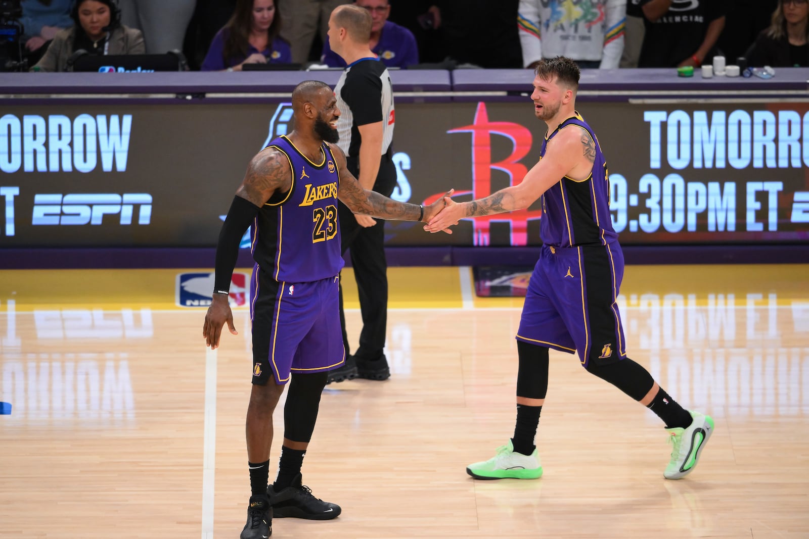 Los Angeles Lakers forward LeBron James (23) and guard Luka Doncic (77) shake hands during the second half of an NBA basketball game against the Dallas Mavericks, Tuesday, Feb. 25, 2025, in Los Angeles. (AP Photo/Kyusung Gong)