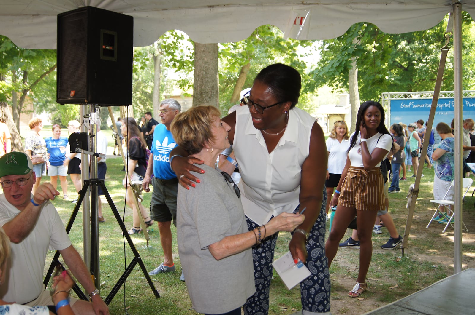 Eloise Broner, president of Good Samaritan Hospital, greets retired employee Lu Musselman. CONTRIBUTED