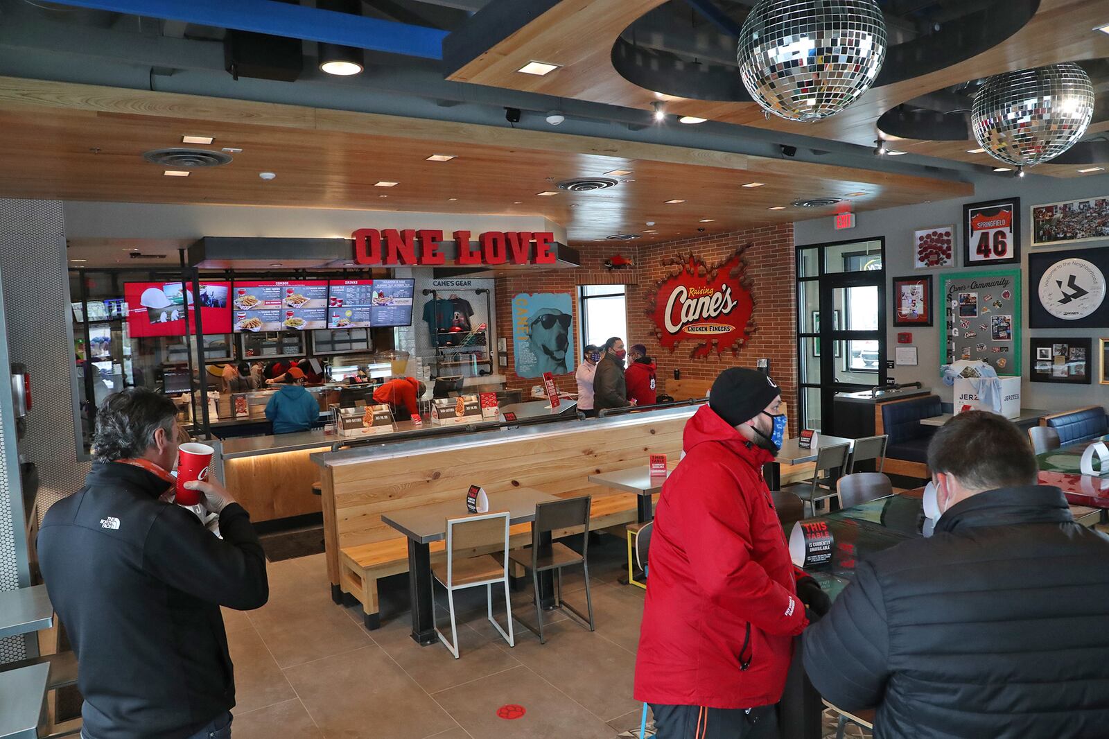 The dinning room and ordering counter inside the new Raising Cane's Chicken Fingers in Springfield. BILL LACKEY/STAFF