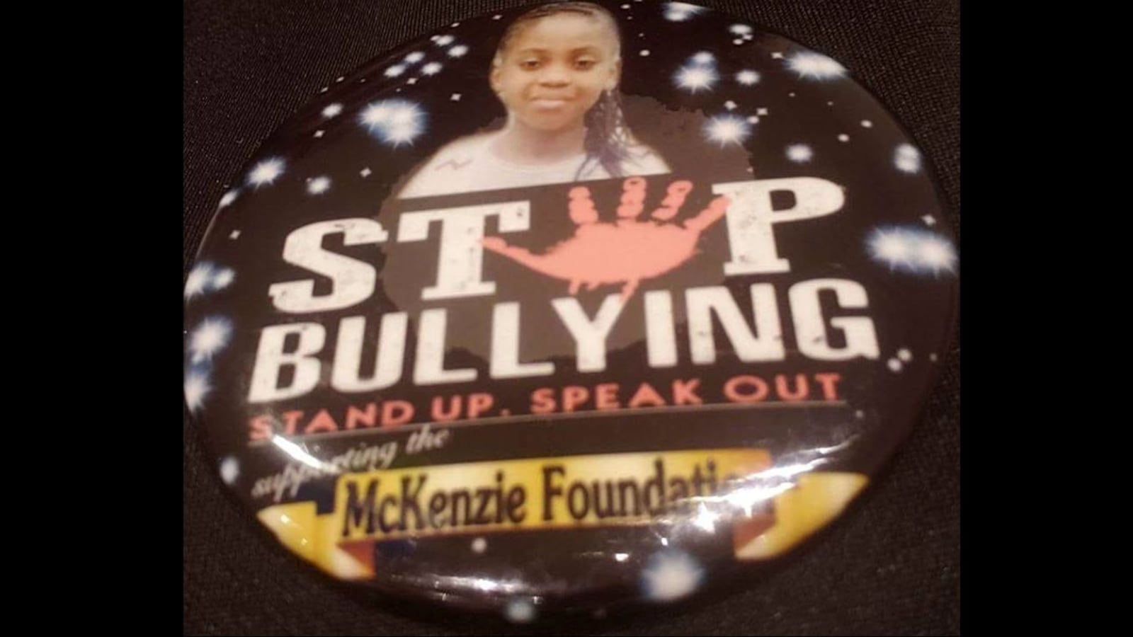 A pin depicts McKenzie Adams, 9, of Linden, Ala., who took her own life Dec. 3, 2018, in her family's home. A federal lawsuit filed Thursday, Jan. 17, 2020, by her family alleges that administrators and teachers at her elementary school failed to protect her from incessant bullying.