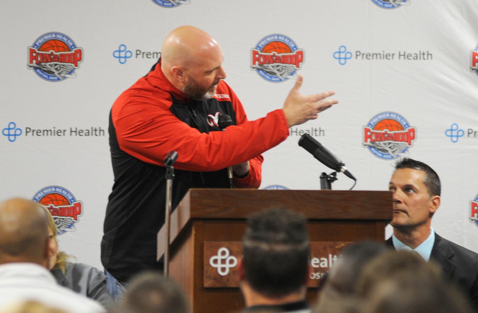 Trotwood-Madison boys basketball coach Rocky Rockhold makes a point during the announcement of the 17th annual Premier Health Flyin’ to the Hoop schedule at Miami Valley Hospital North on Tuesday, Oct. 16, 2018. MARC PENDLETON / STAFF