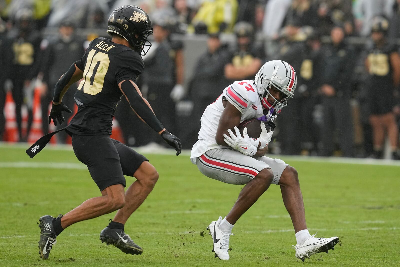 Ohio State's Carnell Tate (17) is tackled by Purdue's Cam Allen (10) during the second half of an NCAA college football game, Saturday, Oct. 14, 2023, in West Lafayette, Ind. Ohio State won 41-7. (AP Photo/Darron Cummings)