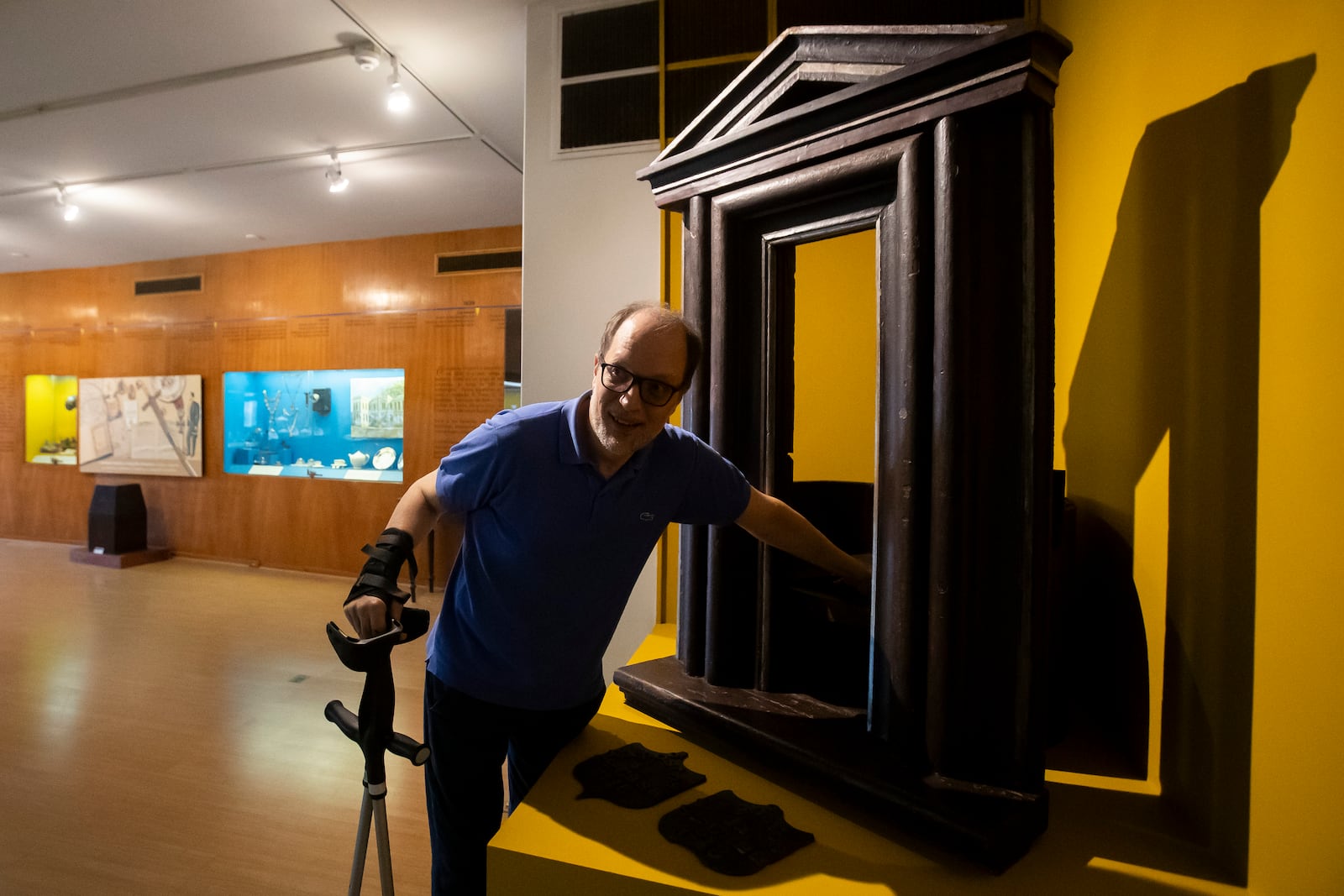 Paulo Knauss, 58, director of the Museum of the Brazilian Historical and Geographical Institute, shows how to use the "wheel of the exposed" or "wheel of the foundlings," a 1738 mechanism used to deposit newborns for charitable institutions, at the Museum of the Brazilian Historical and Geographical Institute in Rio de Janeiro, Friday, Oct. 25, 2024. (AP Photo/Bruna Prado)