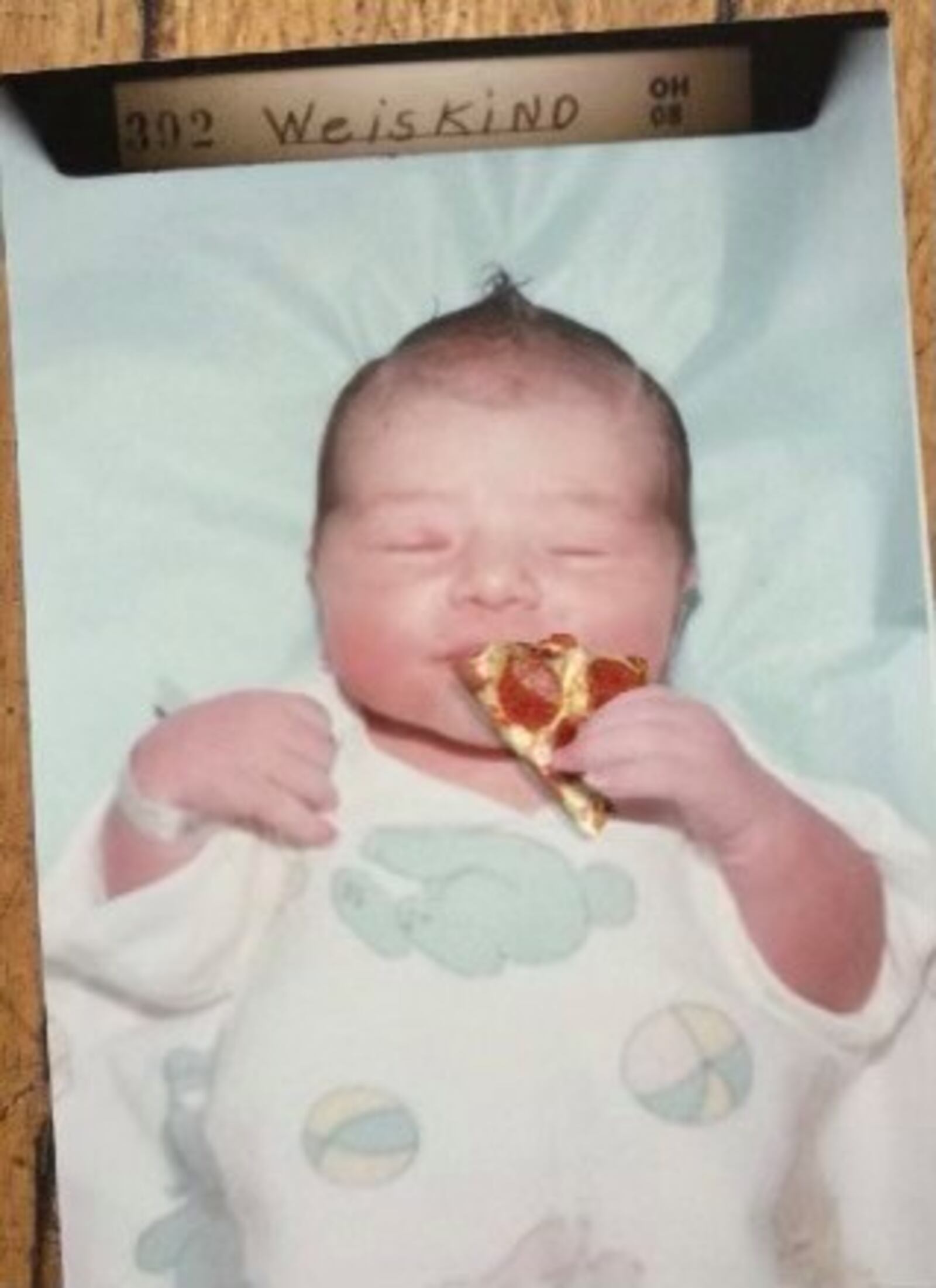 Miriam Weiskind's newborn baby photo in Dayton, photo-shopped with her future passion, pizza.