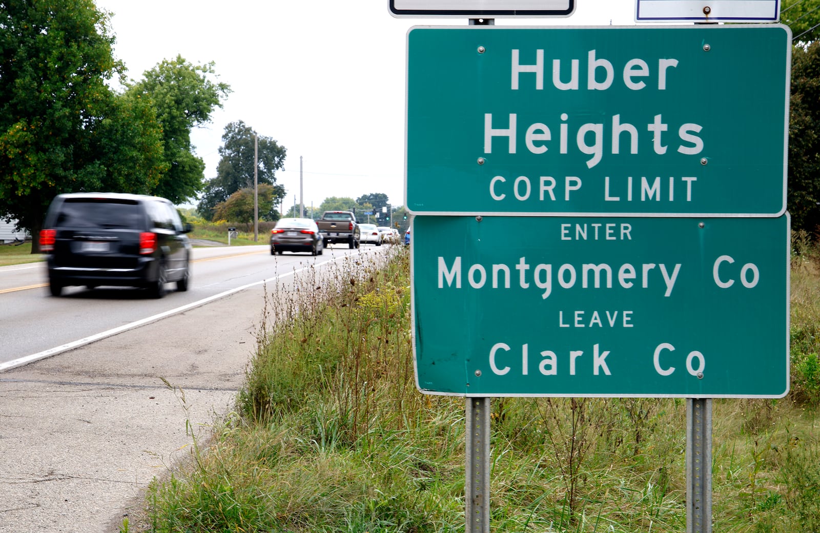 Cars past a sign marking the Huber Heights Corp. Limit along Ohio Route 235 north of Interstate 70 near where the future Buc-ee's will be located. BILL LACKEY/STAFF