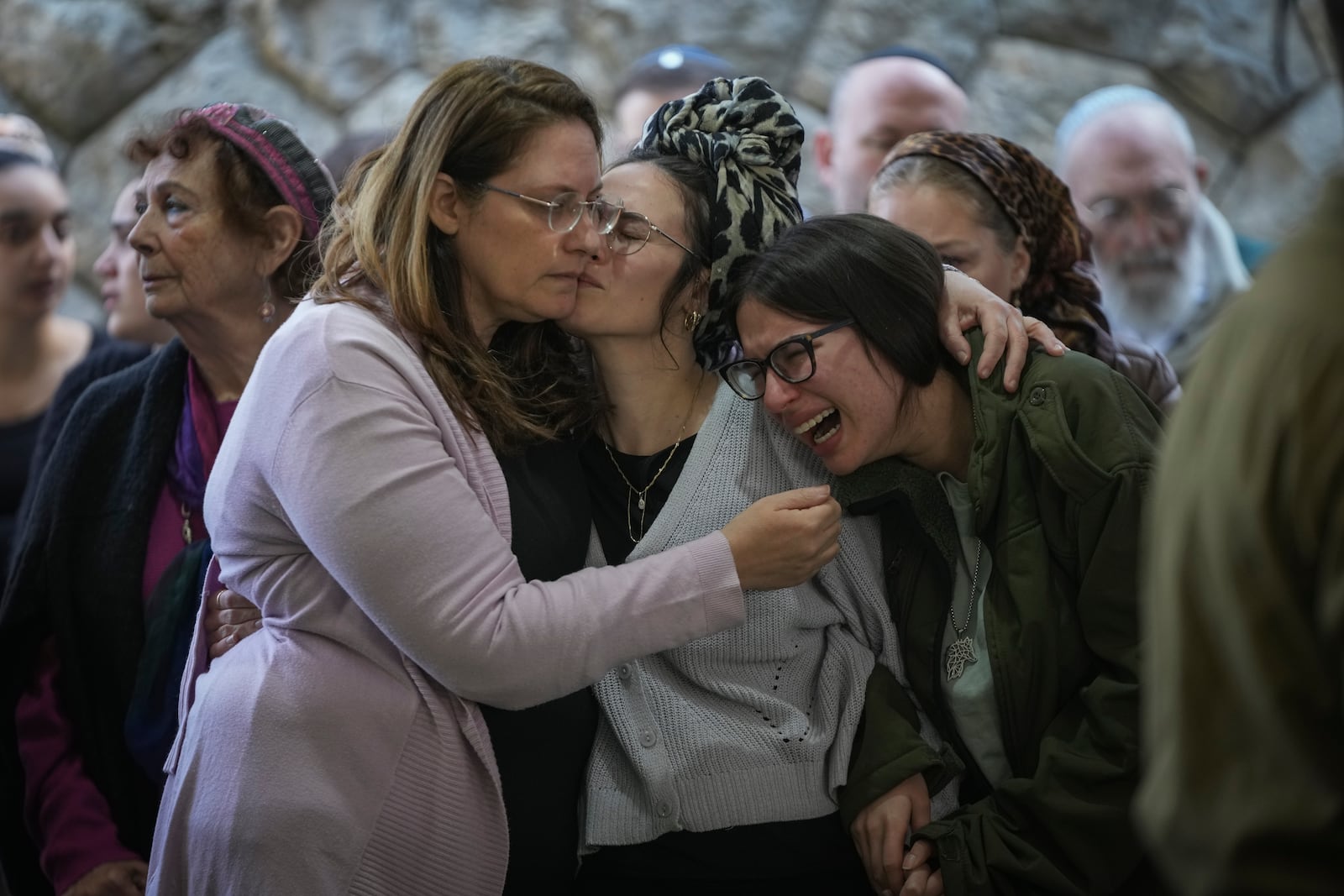 Close relatives of combat engineer squad commander Staff Sgt. Zamir Burke, 20, from Beit Shemesh, mourn during his funeral at Mount Herzl military cemetery in Jerusalem, Israel, Sunday Nov. 1, 2024. Burke was killed in combat with Hamas at the Jabaliya refugee camp in Gaza. (APcPhoto/Mahmoud Illean)