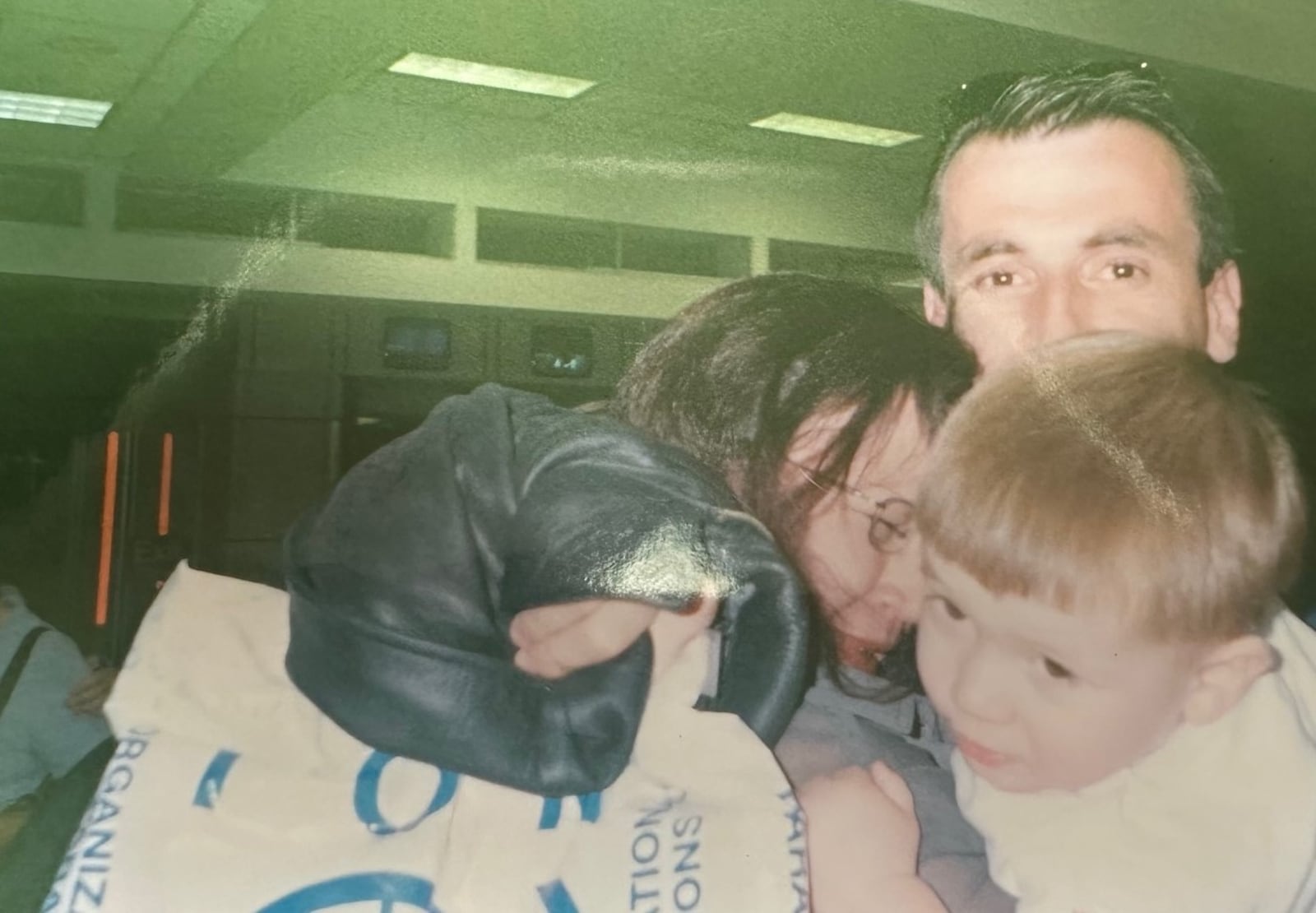 This photo shows the moment in 2002 when Mo Jusufi arrived at the Dayton airport from a refugee camp in Holland and was greeted by his wife, Mira, and son, Albert, both of whom had arrived here 9 months earlier. CONTRIBUTED