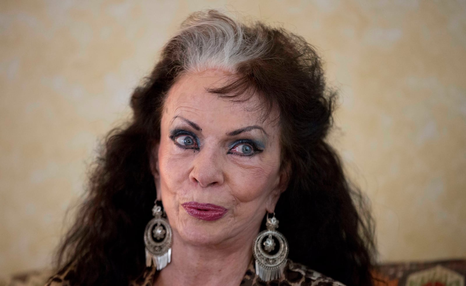 FILE - Dancer Yolanda Montez, better known by her stage name Tongolele, gives an interview in Mexico City, March 18, 2014. (AP Photo/Eduardo Verdugo, File)