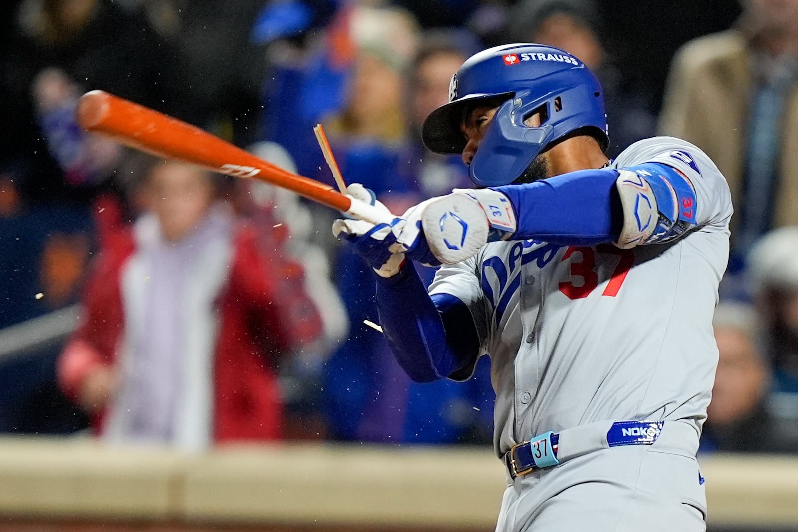 Los Angeles Dodgers' Teoscar Hernández breaks is bat and flys out against the New York Mets during the third inning in Game 3 of a baseball NL Championship Series, Wednesday, Oct. 16, 2024, in New York. (AP Photo/Frank Franklin II)