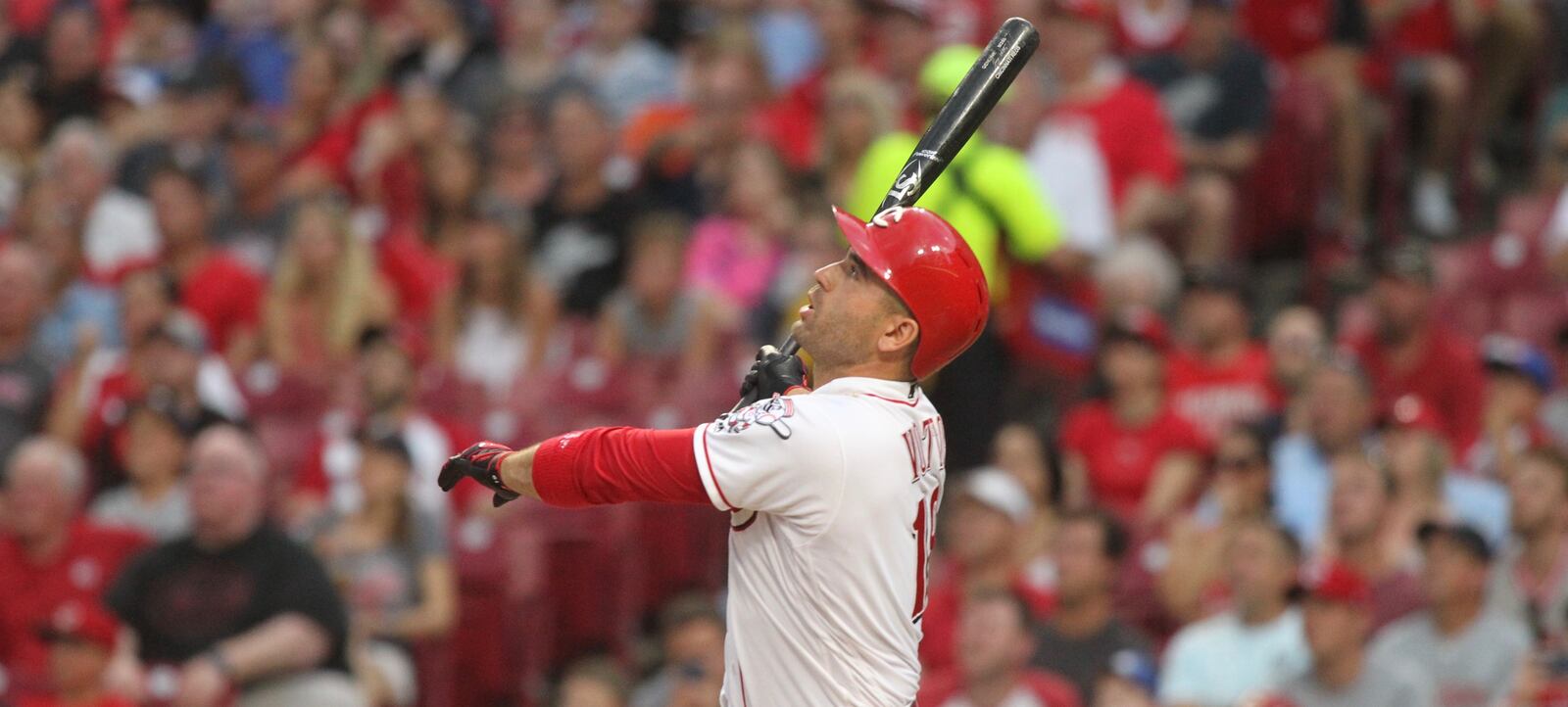 The Reds' Joey Votto hits a grand slam in the third inning against the Tigers on Tuesday, June 19, 2018, at Great American Ball Park in Cincinnati.