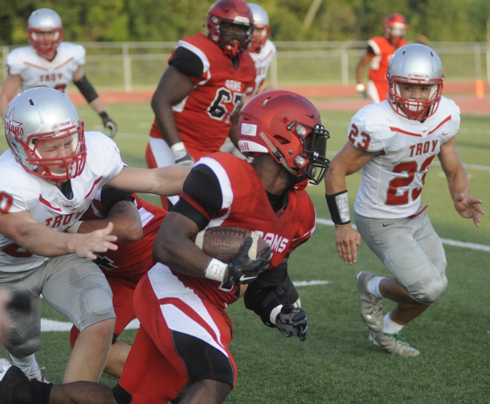 Trotwood running back Ra’veion Hargrove is pursued by Troy’s Blake Burton (left) and Shane Shoop. Trotwood-Madison hosted Troy in a Week 1 high school football game on Friday, Aug. 25, 2017. MARC PENDLETON / STAFF