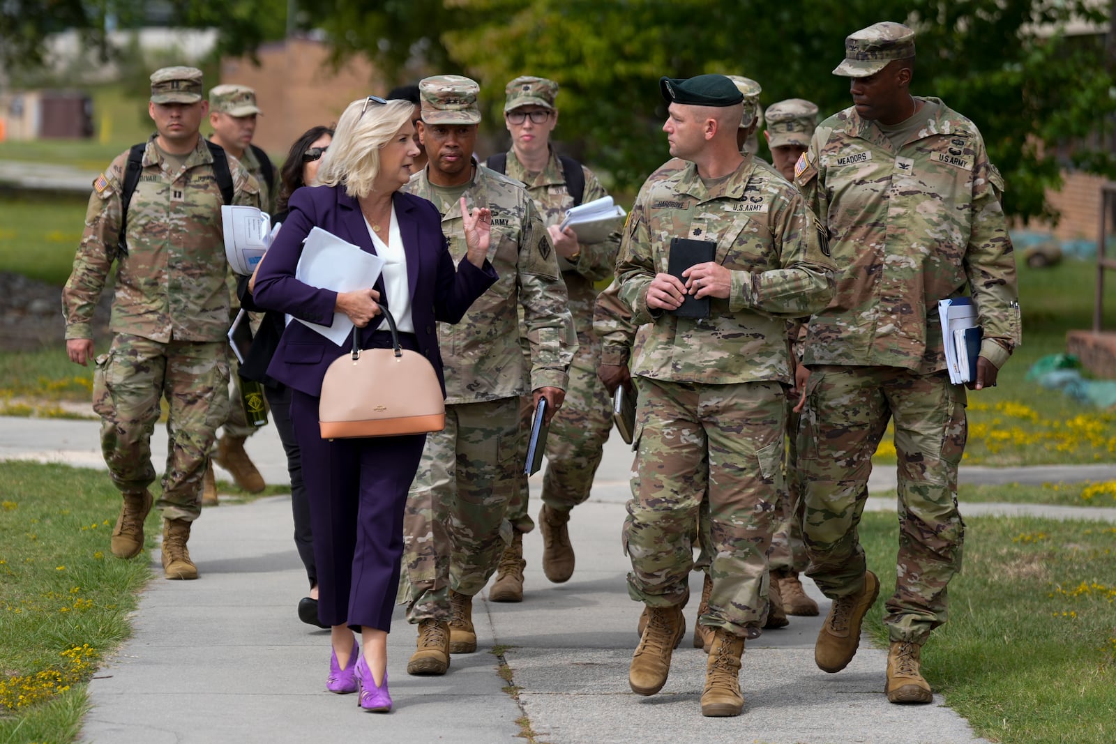 FILE - Army Secretary Christine Wormuth, front left, walks during a tour with soldiers at Fort Jackson, a U.S. Army Training Center, Sept. 25, 2024, in Columbia, S.C. (AP Photo/Chris Carlson, File)