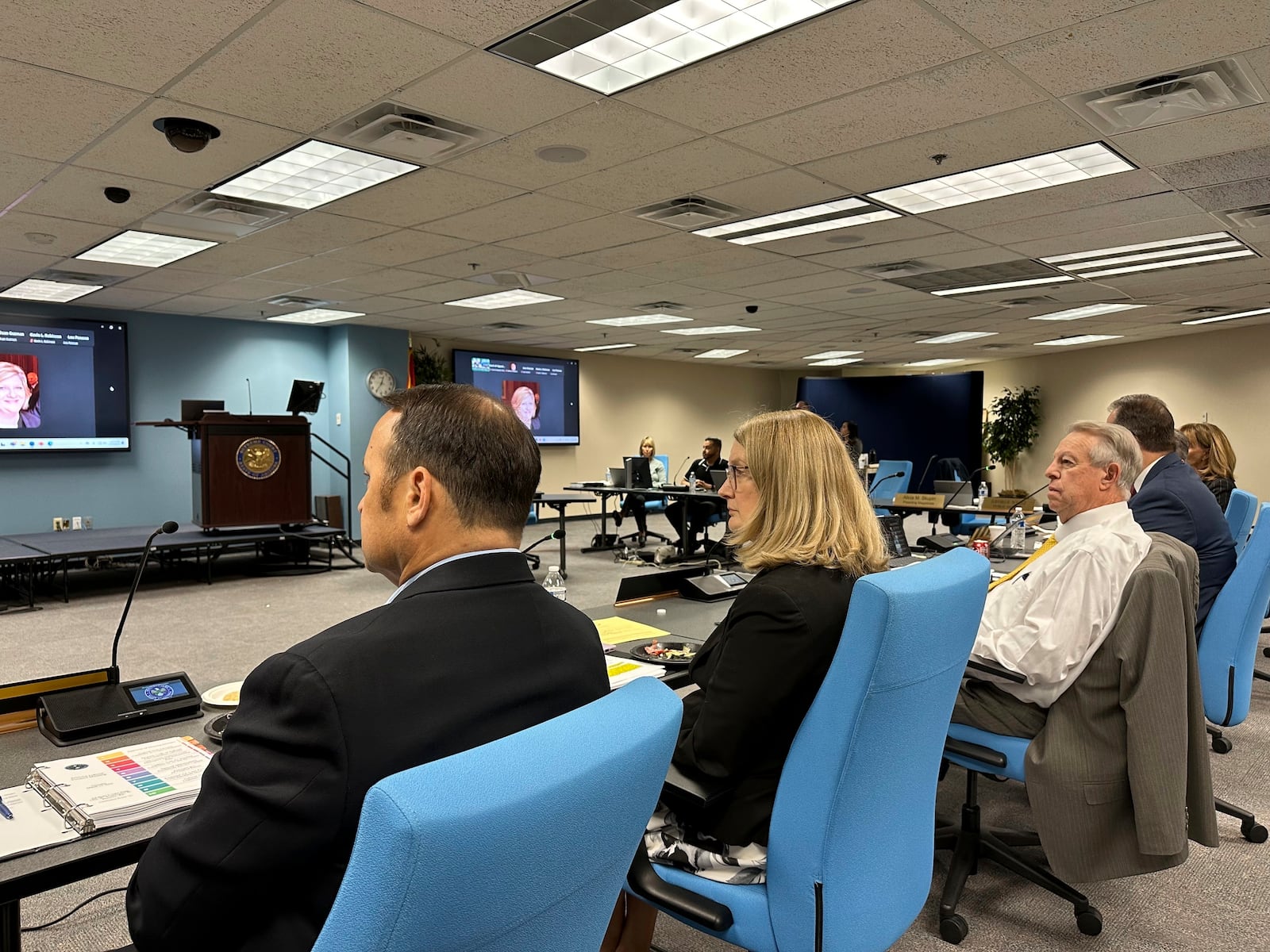 Arizona Supreme Court Chief Justice Ann Timmer, second from left, and David Byers, director of the Administrative Office of the Courts, listen as the Arizona Judicial Council discusses the high court's new use of AI-generated avatars that are used to relay information to the public on Thursday, March 13, 2025., in Phoenix. (AP Photo/Sejal Govindarao)