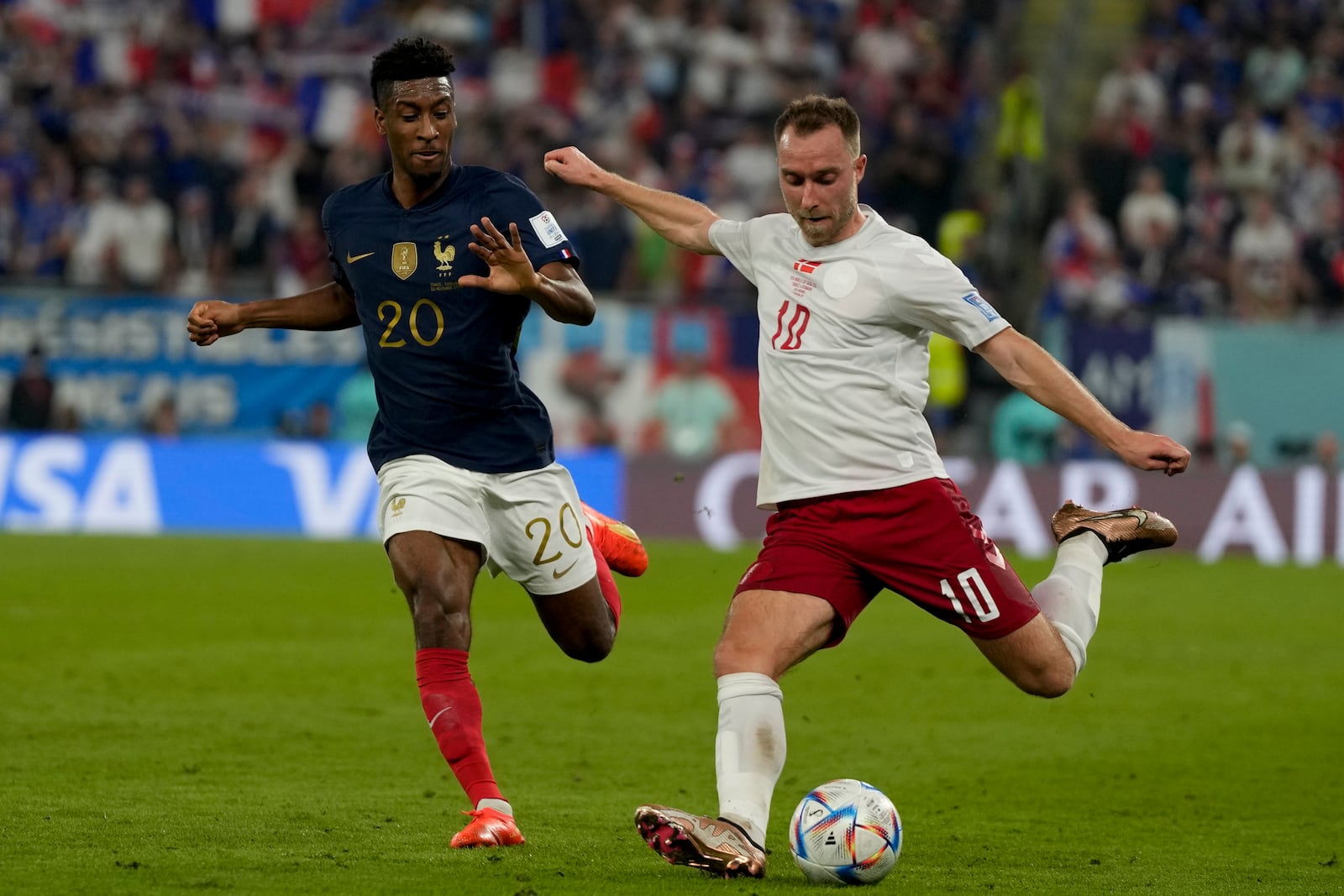 Denmark's Christian Eriksen, right, plays in a World Cup soccer match against France in Qatar, on Saturday, Nov. 26, 2022. Eriksen went into cardiac arrest on the field during a game in June 2021. (AP Photo/Frank Augstein)