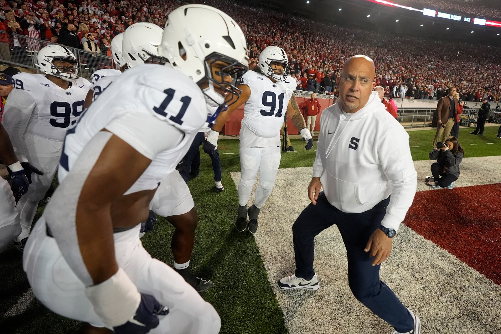 Penn State head coach James Franklin brings his players on the field before an NCAA college football game against the Wisconsin Saturday, Oct. 26, 2024, in Madison, Wis. (AP Photo/Morry Gash)