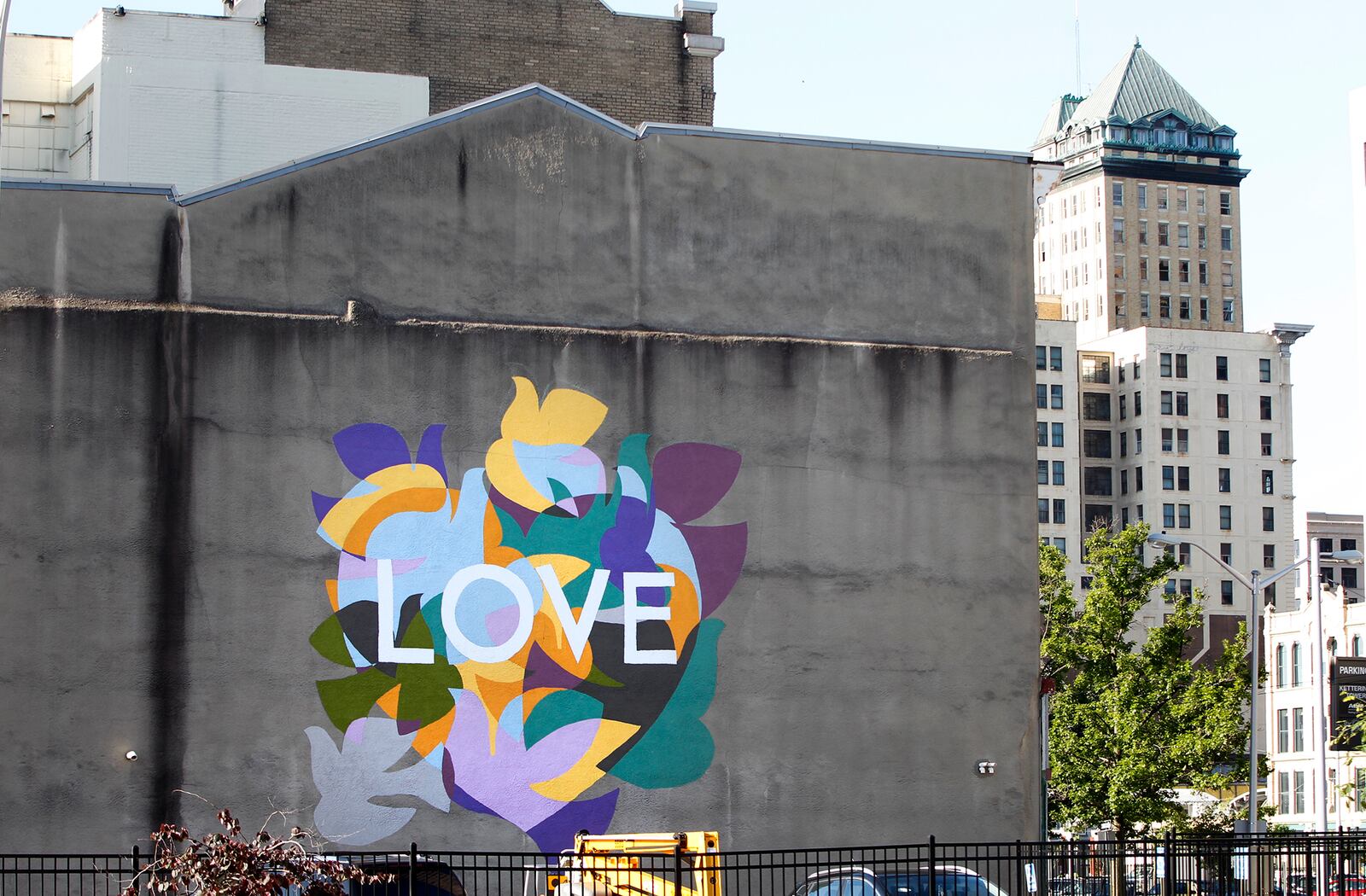 A new mural in downtown Dayton celebrates the cityâs welcoming and inclusive spirit. The public art piece was designed by Dayton artist Amy Deal and inspired by Daytonâs Paul Laurence Dunbarâs poem, âThe Dove.â LISA POWELL / STAFF