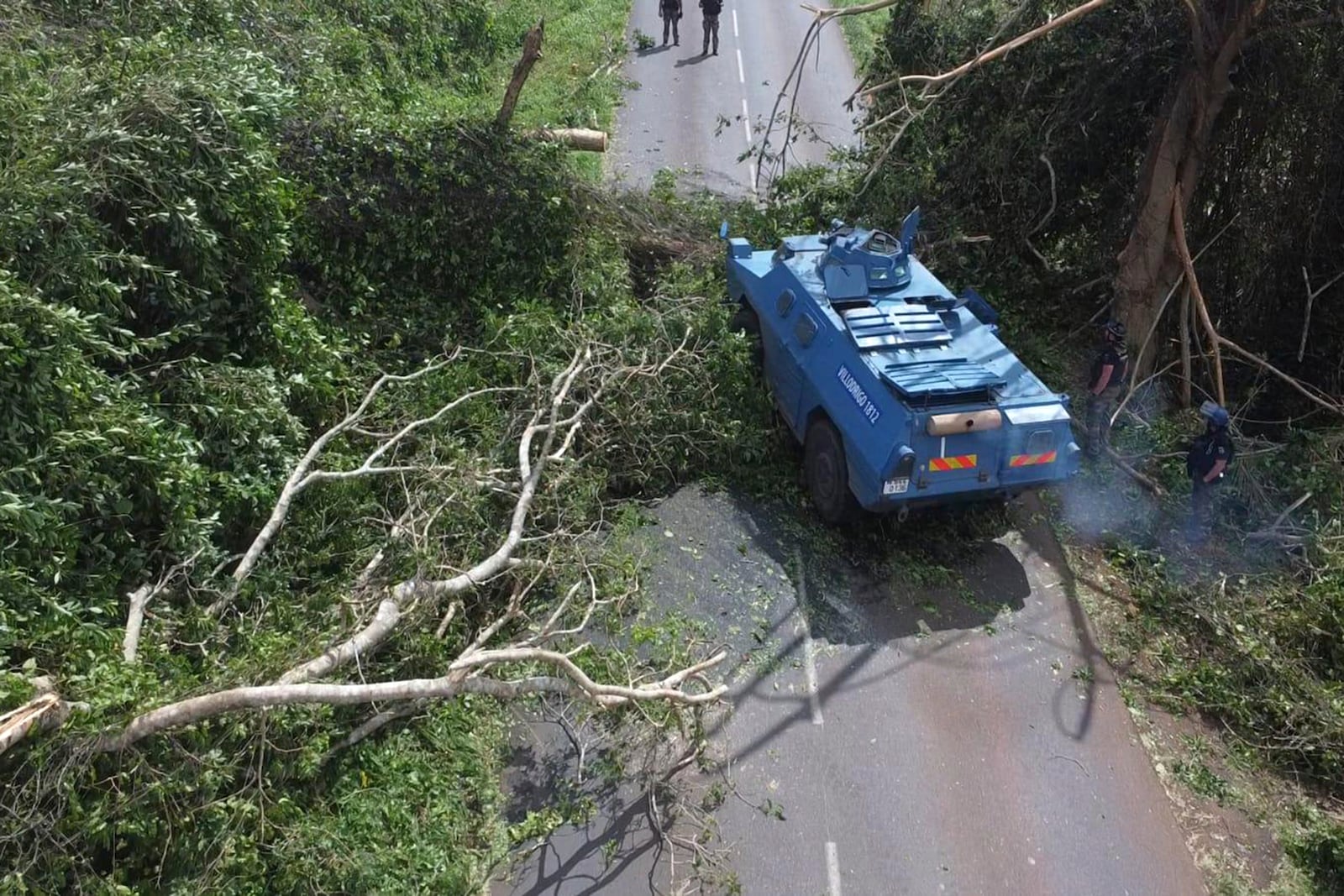 This photo provided on Monday Dec.16, 2024 by the Gendarmerie Nationale, shows an armored vehicle clearing a road Sunday, Dec. 15, 2024 in Mayotte as France rushed rescue teams and supplies to its largely poor overseas department in the Indian Ocean that has suffered widespread destruction. (Gendarmerie Nationale via AP)