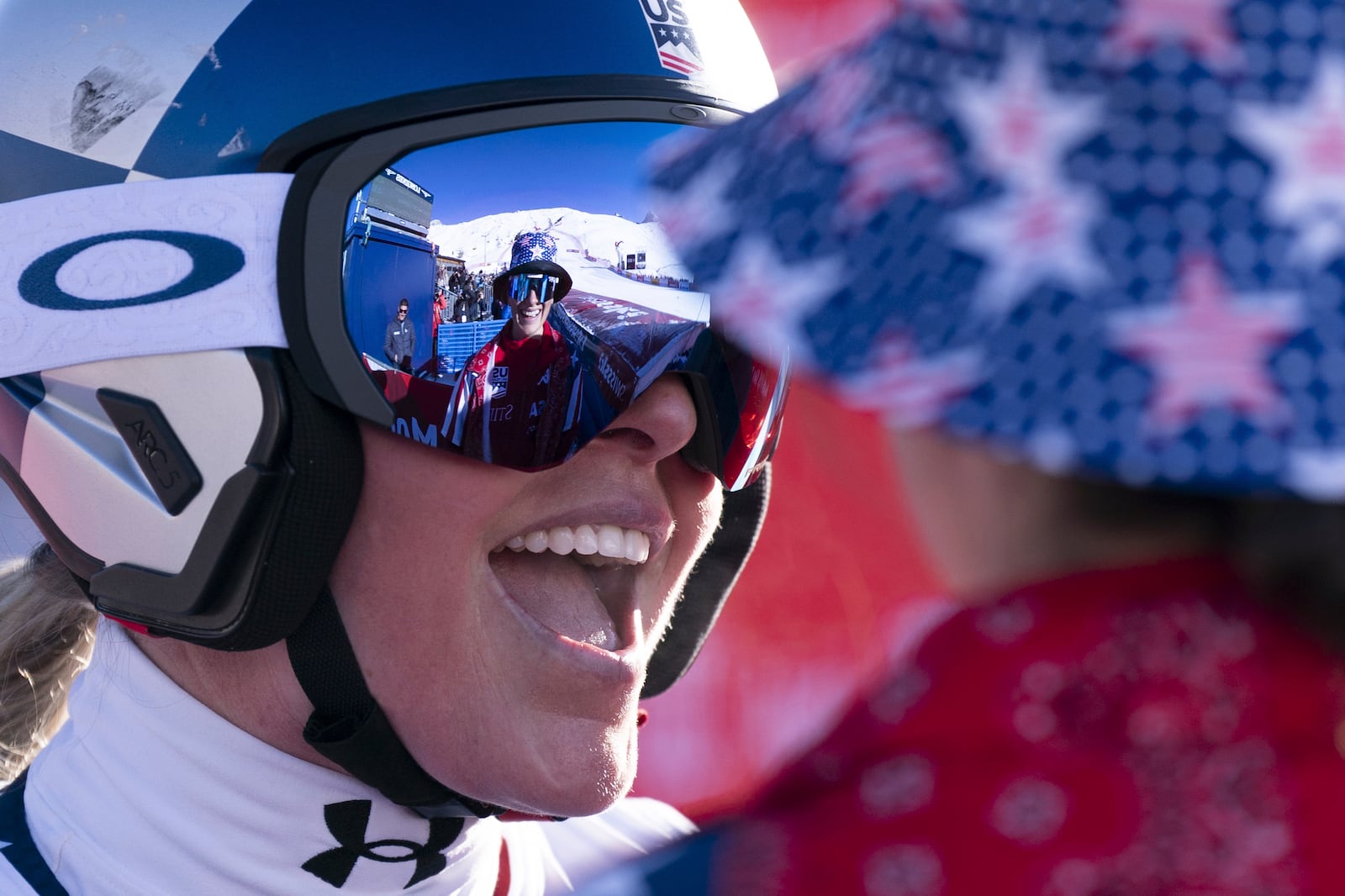 United States' Lindsey Vonn, right, smiles after completing an alpine ski, women's World Cup super G, in St. Moritz, Switzerland, Saturday, Dec. 21, 2024. (Til Buergy/Keystone via AP)