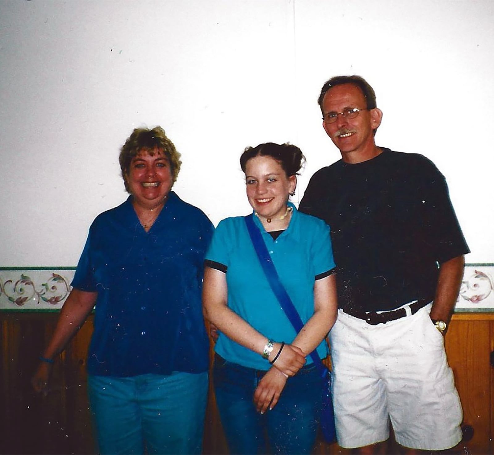 Harcourt (center) with her parents Kathy (L) and Brown in 2001. Harcourt said it was her mother, who has been diagnosed with bi-polar disorder, who inspired her to give back to others. CONTRIBUTED