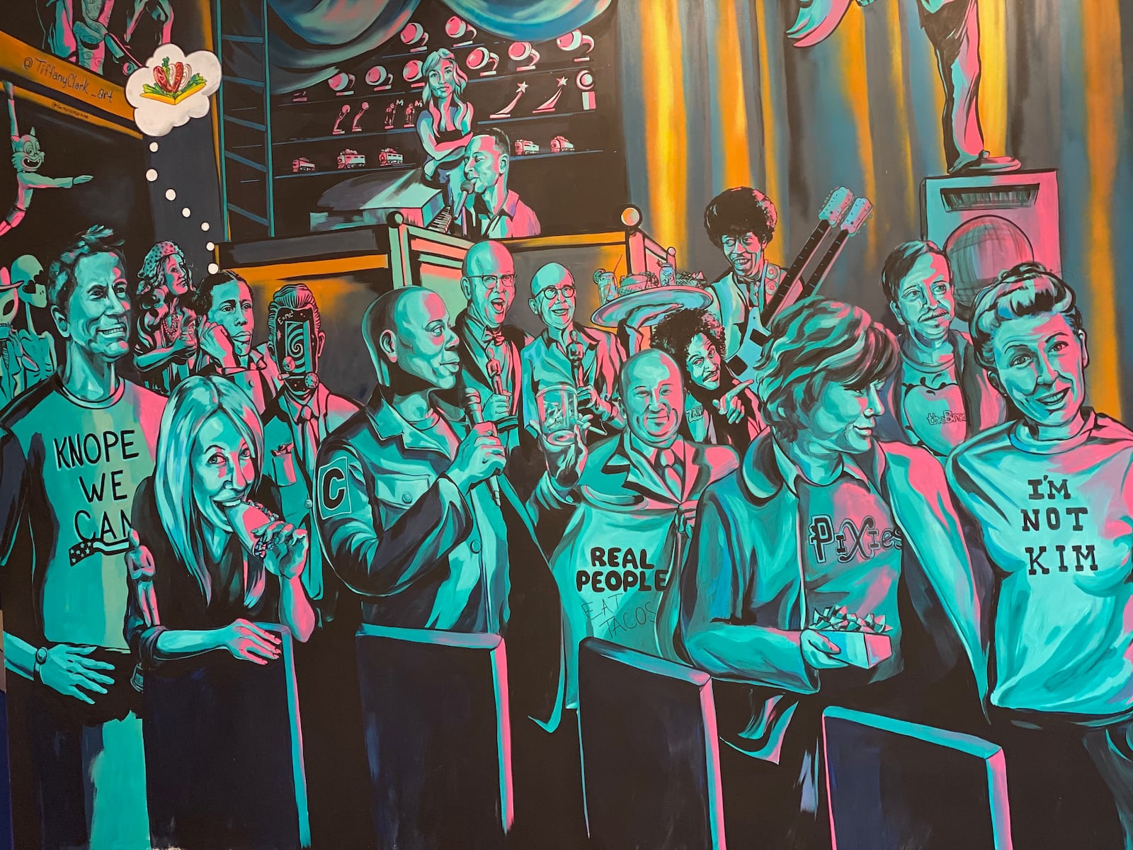 Dayton artist Tiffany Clark has created a version of the Victoria Theater and filled it with local celebrities for the new Condado Tacos restaurant at The Greene Towne Center.  âI crammed as many famous Dayton peeps in there as possible,â she said. CONTRIBUTED PHOTO/ CONDADO TACOS