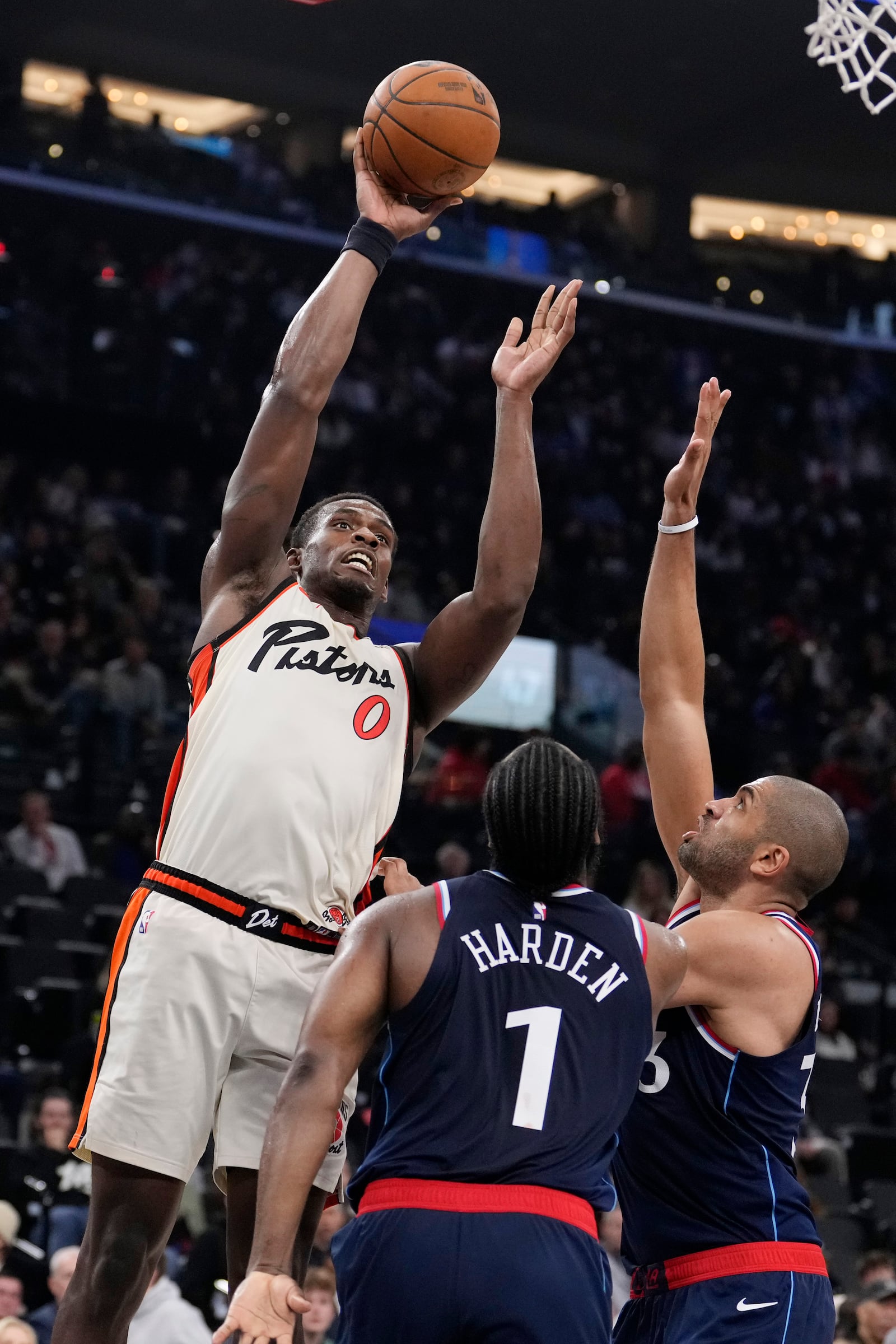 Detroit Pistons center Jalen Duren, left, shoots as Los Angeles Clippers guard James Harden, center, and forward Nicolas Batum defend during the first half of an NBA basketball game Wednesday, March 5, 2025, in Inglewood, Calif. (AP Photo/Mark J. Terrill)