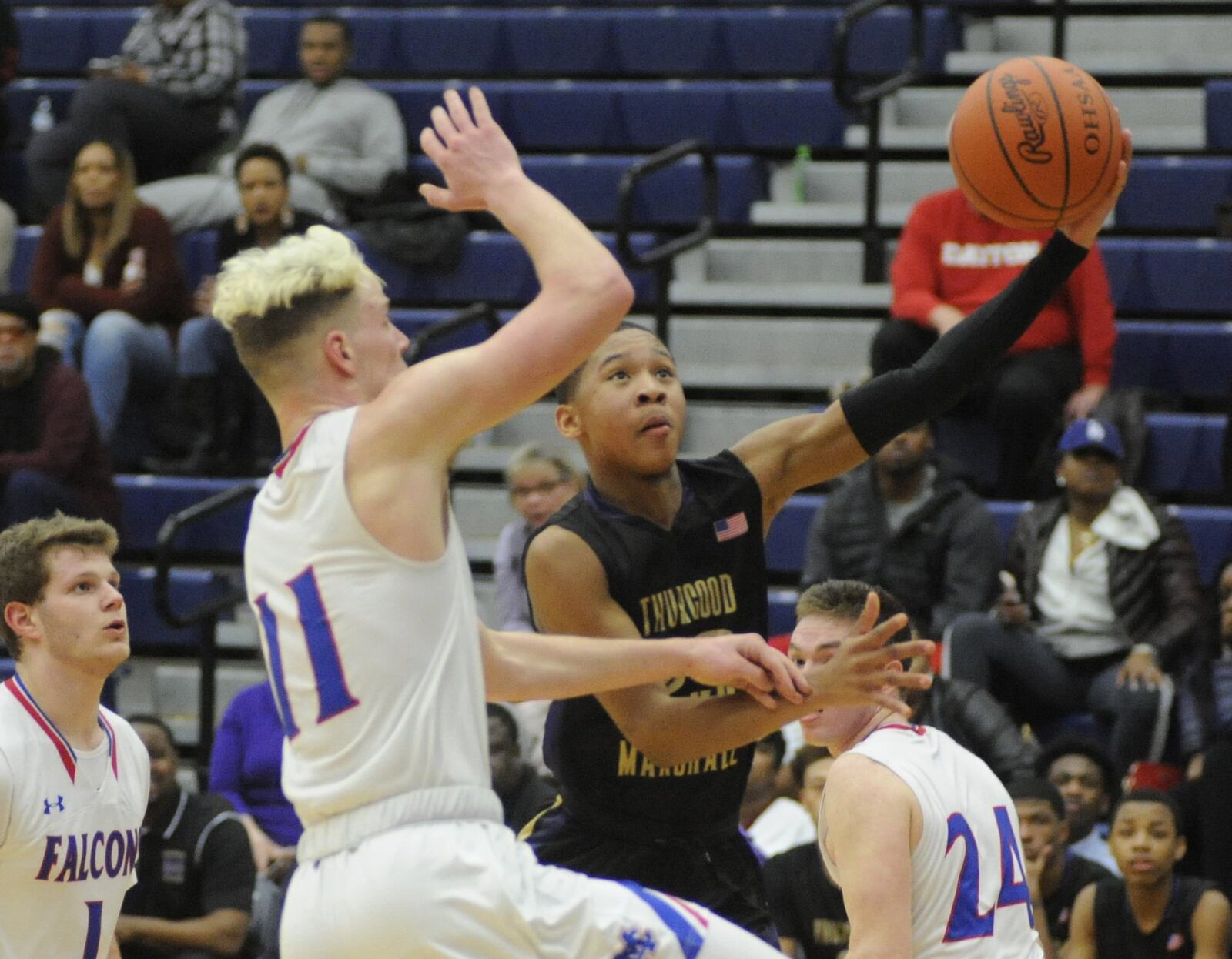 Mekhi Elmore (with ball) of Thurgood avoids Thomas Myers of Massie. Thurgood Marshall defeated Clinton-Massie 68-51 in a D-II boys high school basketball sectional semifinal at Trent Arena on Tuesday, Feb. 26, 2019. MARC PENDLETON / STAFF