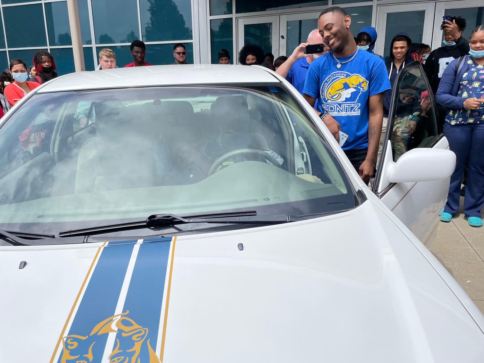 Thomas Terrell, a senior at David H. Ponitz Career Technology Center, won a free car in a school raffle and gave it to his sister, Jamese Easterling. Photo courtesy Dayton Public Schools.