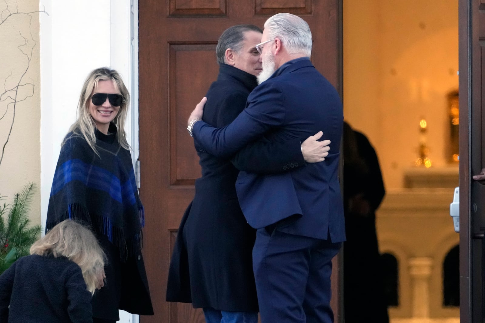 Hunter Biden, his wife Melissa Cohen Biden and their son Beau are greeted as they arrive at St. Joseph on the Brandywine Catholic Church in Wilmington, Del., on Wednesday, Dec. 18, 2024. Wednesday marks the 52nd anniversary of the car crash that killed President Joe Biden's first wife Neilia Hunter Biden and 13-month-old daughter Naomi. (AP Photo/Ben Curtis)