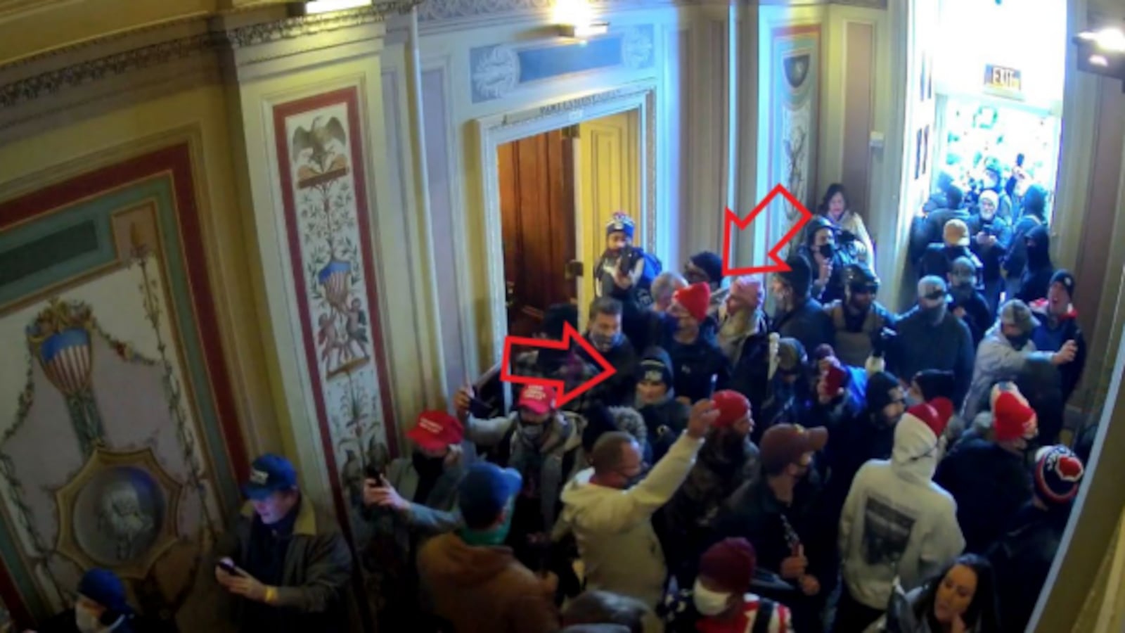 Shawndale Chilcoat (black beanie) and Donald Chilcoat (red beanie), shown in Capitol building security footage entering the building with the crowd. The photo was included in a federal criminal complaint filed with the U.S. District Court for the District of Columbia.