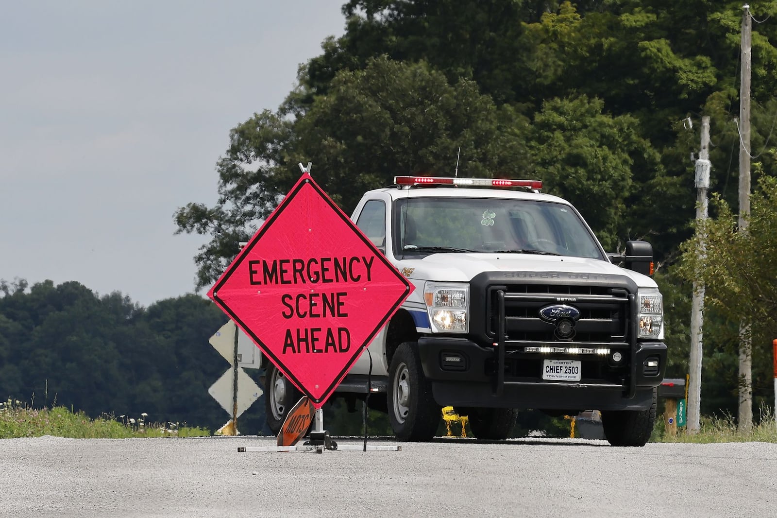 Roads were blocked for hours in the area of a standoff Thursday, Aug. 11, 2022, in Clinton County after an armed man tried to breach security at the FBI's Cincinnati office and fled north. The unidentified man was shot and killed following a pursuit and standoff lasting roughly six hours. NICK GRAHAM/STAFF