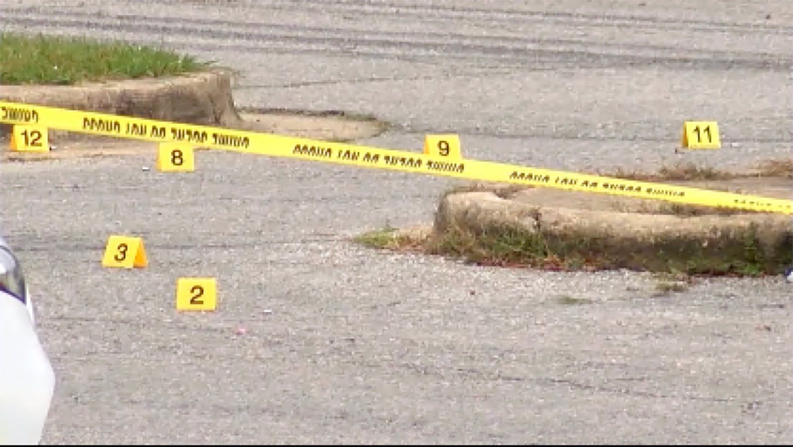 This image taken from video provided by WSFA shows evidence markers as law enforcement work at the scene of a shooting at Tuskegee University, Sunday, Nov. 10, 2024, in Tuskegee, Ala. (WSFA via AP)