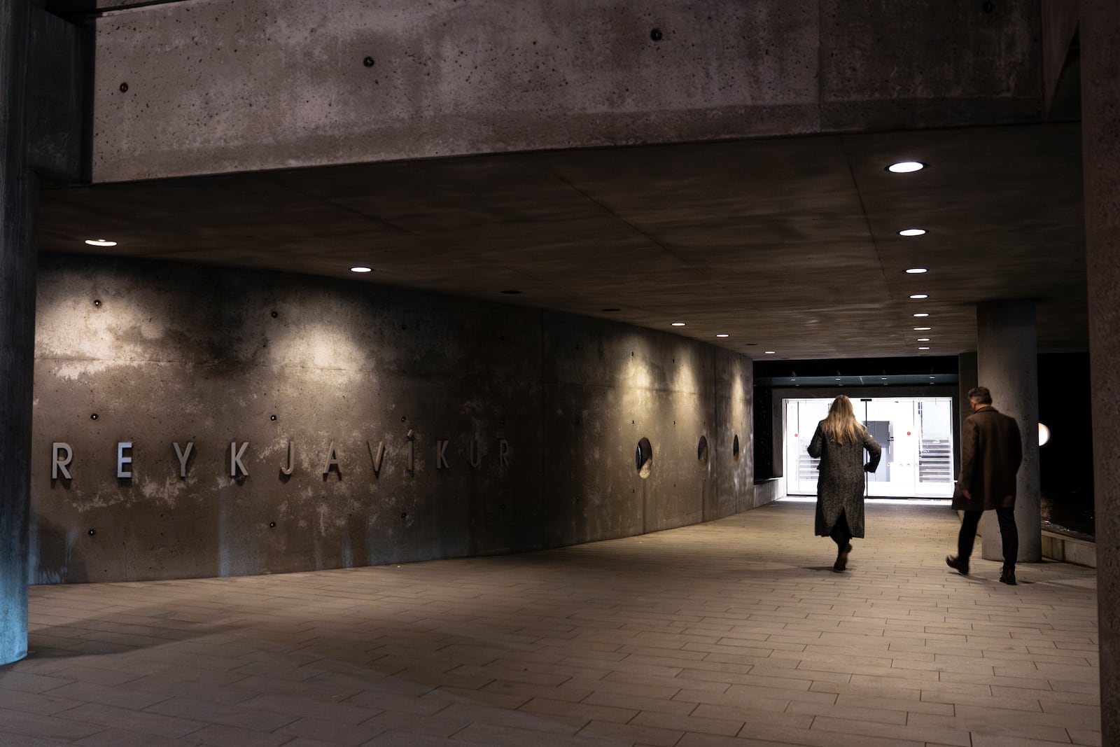 People arrive to vote in the Iceland election, at Reykjavik city hall, Iceland, Saturday, Nov. 30, 2024. (AP Photo/Marco Di Marco)