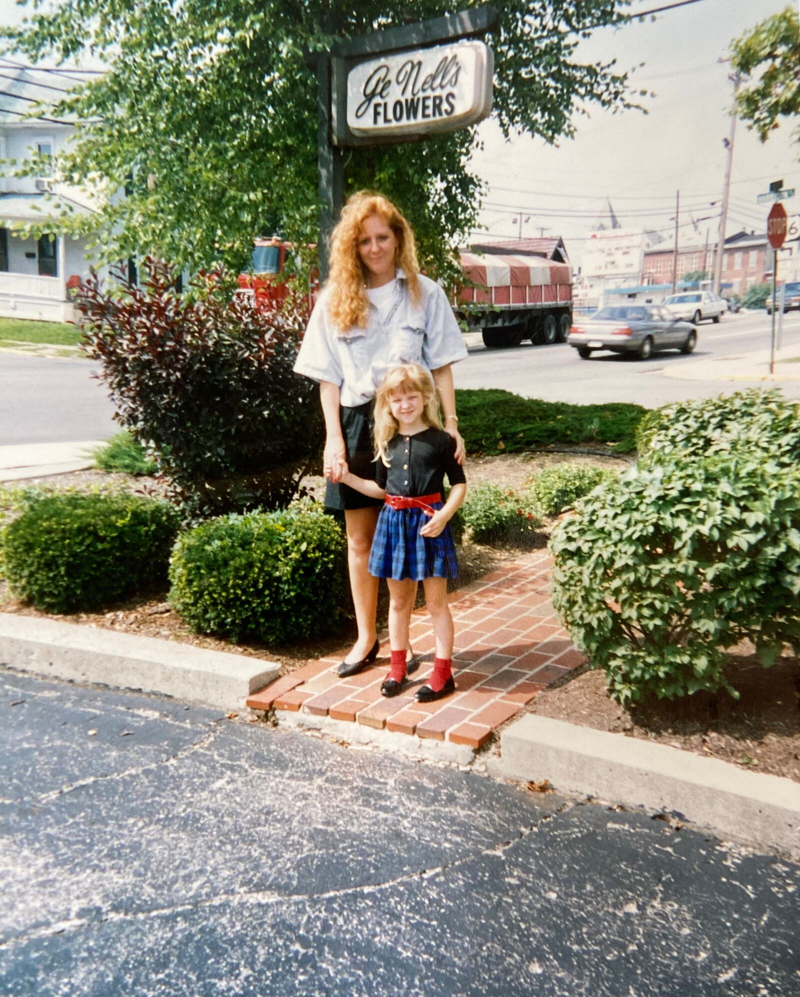 Casey Virgallito (right) and her mom, Kim Hampshire, stand in front of GeNell's Flowers in 1992. The family originally purchased the business from GeNell Horner in 1982.