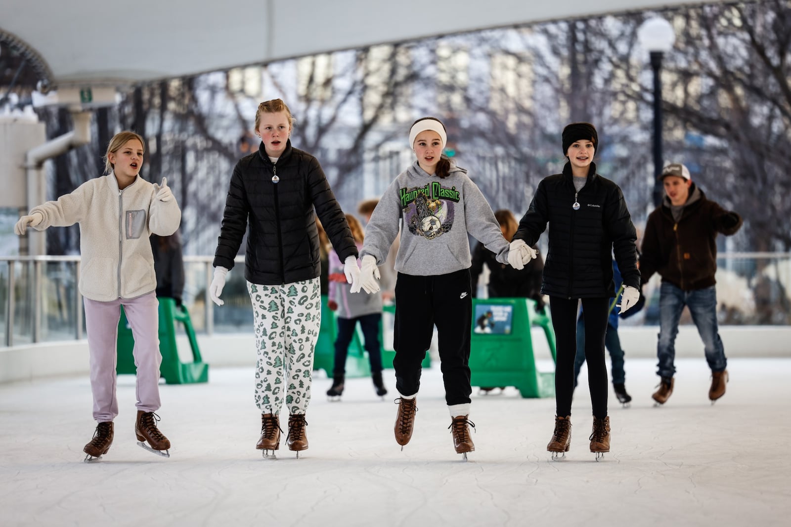 Lots of people are enjoying the warm weather on the first day of winter at RiverScape in Dayton. Jim Noelker/Staff