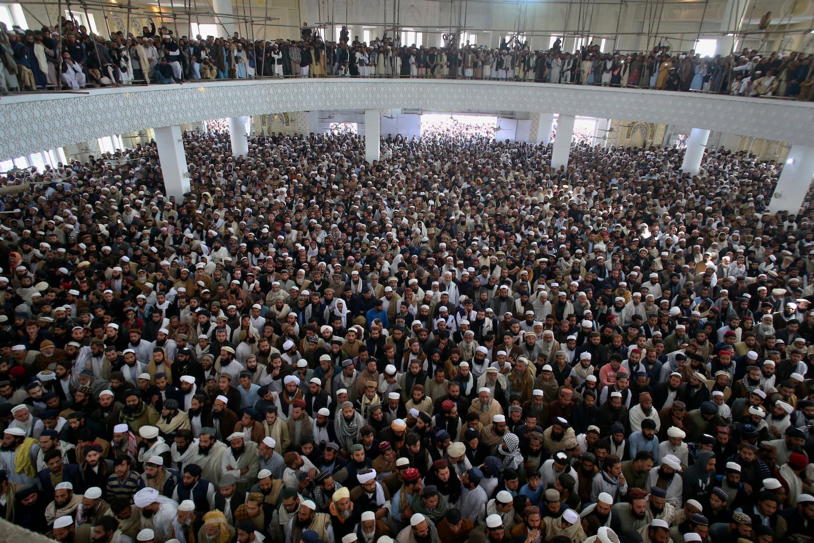 Mourners attend the funeral prayer of a senior Muslim cleric, Hamidul Haq who was killed in the Friday's suicide bomb attack, at a pro-Taliban seminary in Akora Khattak, Pakistan, Saturday, March 1, 2025. (AP Photo/Muhammad Sajjad)