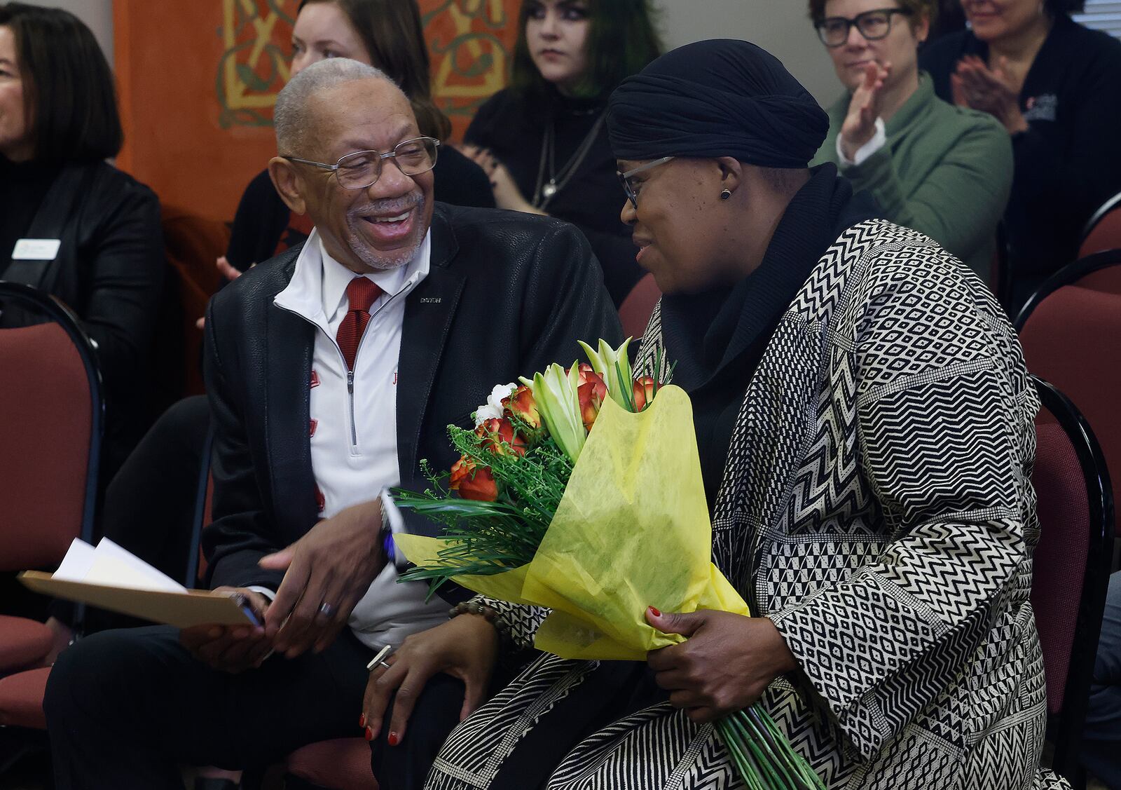 Dayton Mayor Jeffrey J. Mims talks with Sierra Leone who will serve as the first poet laureate for the City of Dayton, Friday, Feb. 7, 2025 at a media event at the Paul Laurence Dunbar House Visitor Center. MARSHALL GORBY\STAFF