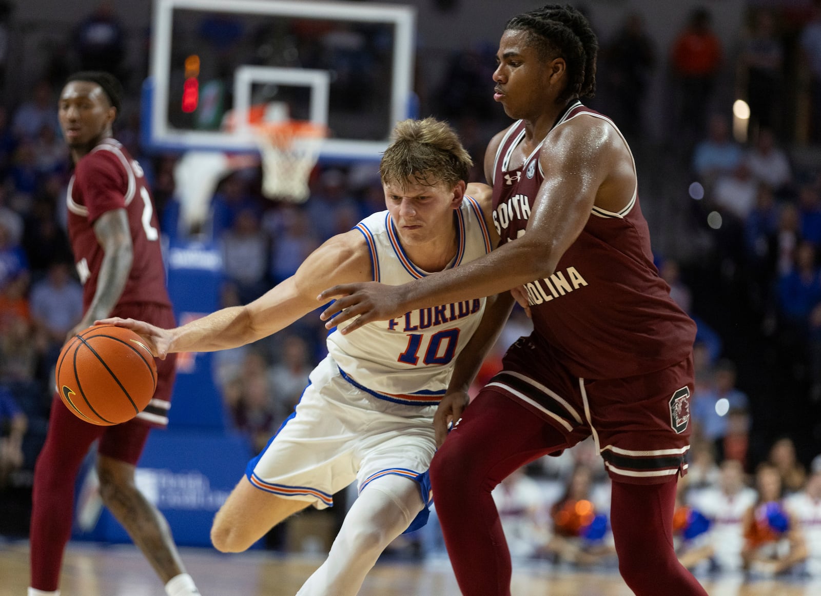 Florida forward Thomas Haugh (10) drives on South Carolina forward Collin Murray-Boyles, right, during the second half of an NCAA college basketball game, Saturday, Feb. 15, 2025, in Gainesville, Fla. (AP Photo/Alan Youngblood)