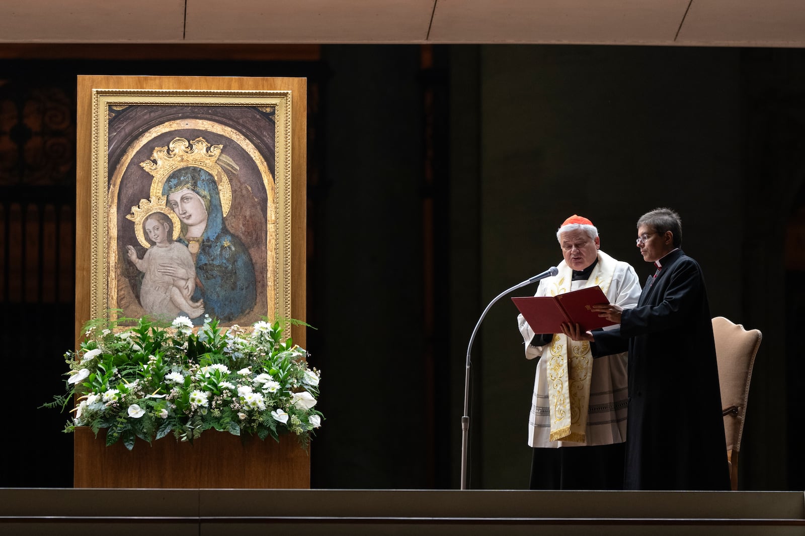 Cardinal Konrad Krajewski, Almsman of His Holiness, leads a nightly rosary prayer for the health of Pope Francis in St. Peter's Square at the Vatican, Sunday, March 2, 2025. (AP Photo/Mosa'ab Elshamy)