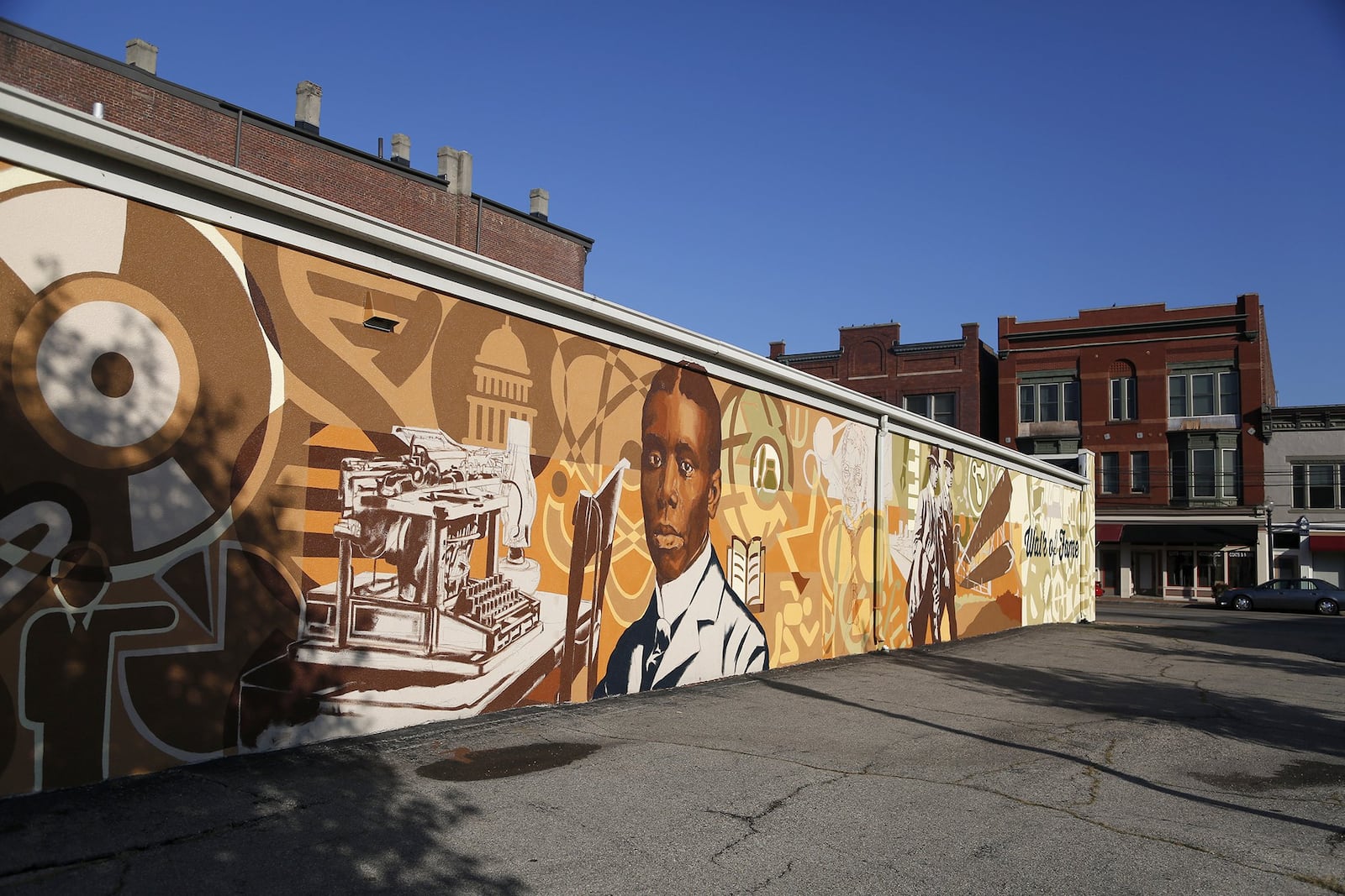 In Dayton’s Wright-Dunbar neighborhood the Dayton Region’s Walk of Fame mural, in the 1100 block of W. Third Street, commemorates poet Paul Laurence Dunbar and aviation pioneers Orville and Wilbur Wright. LISA POWELL / STAFF