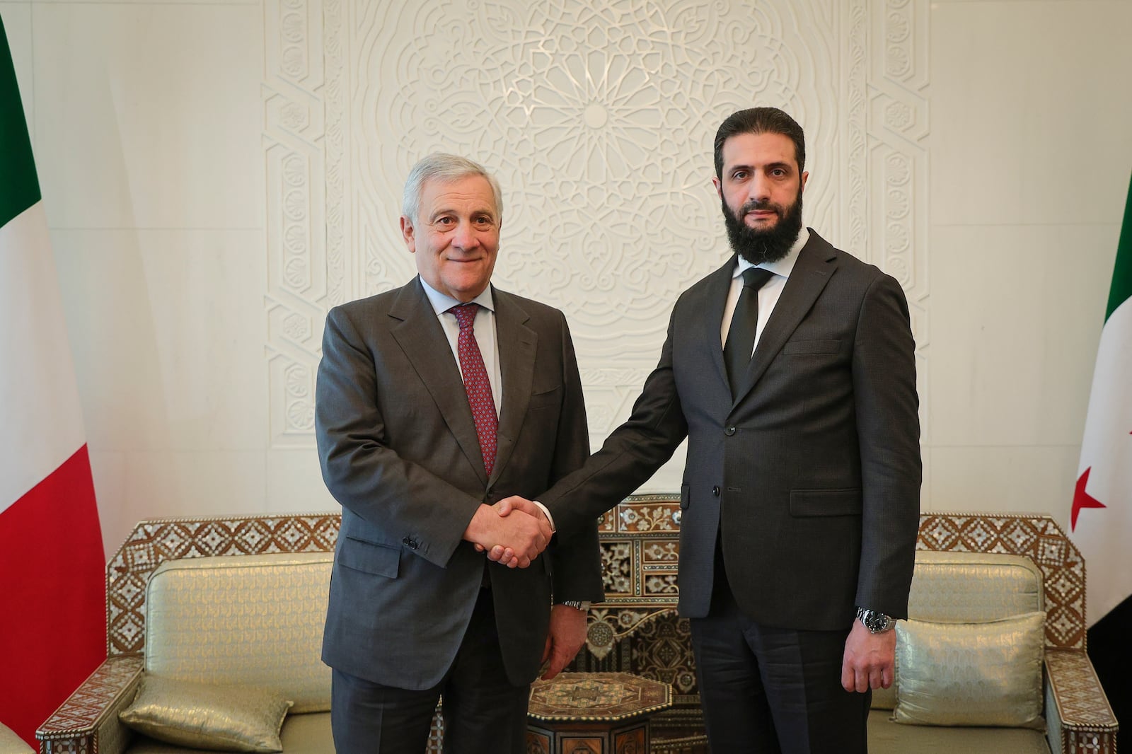 In this photo released by the Syrian official news agency SANA, Syria's de facto leader Ahmad al-Sharaa, formerly known as Abu Mohammed al-Golani, right, meets with Italian foreign minister Antonio Tajani in Damascus, Syria, Friday, Jan. 10, 2025. (SANA via AP)