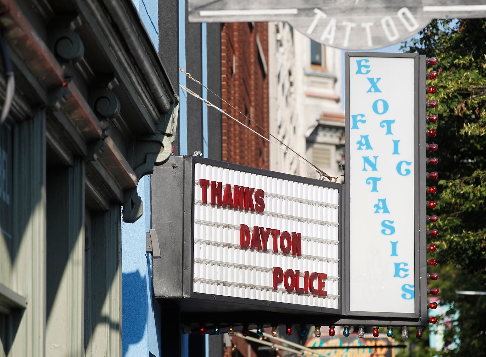 Memorials to the Dayton shooting victims and dozens of media workers filled the sidewalks of the Oregon District on Monday morning in the wake of ten people being killed, including the shooter, and more than two dozen injured at 1:00 A.M. on Sunday morning.  TY GREENLEES / STAFF