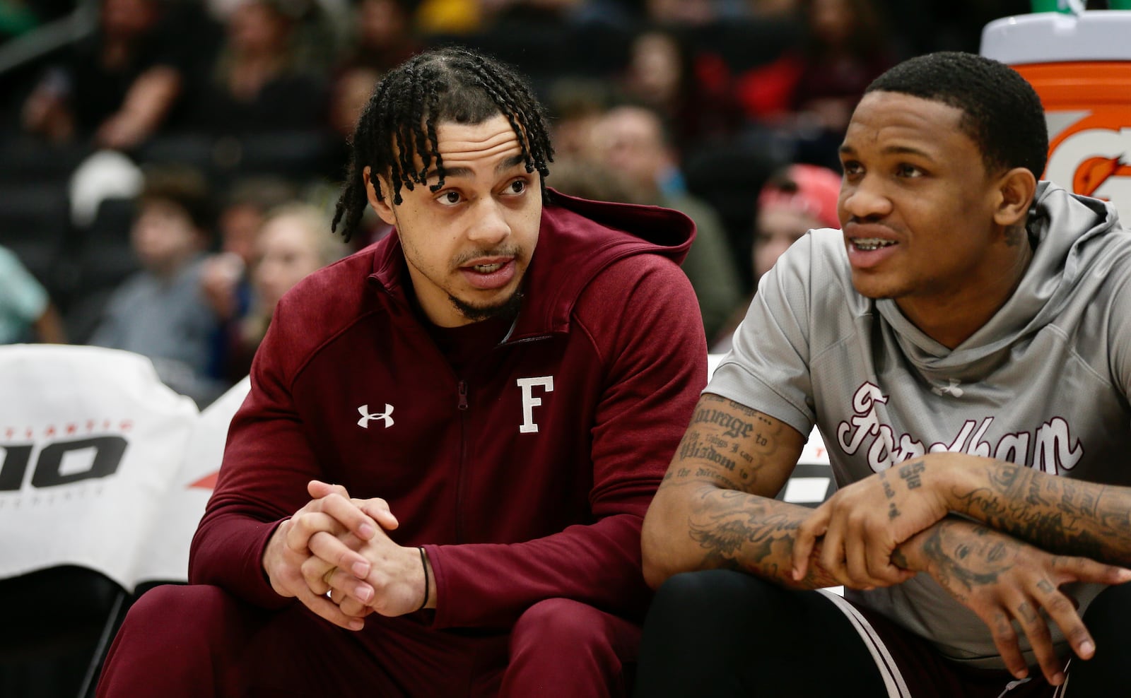 Wayne grad Darius Quisenberry, left, talks to a teammate on the Fordham bench during a game against Davidson on Friday, March 11, 2022, in the quarterfinals of the Atlantic 10 Conference tournament at Capital One Arena in Washington, D.C. David Jablonski/Staff