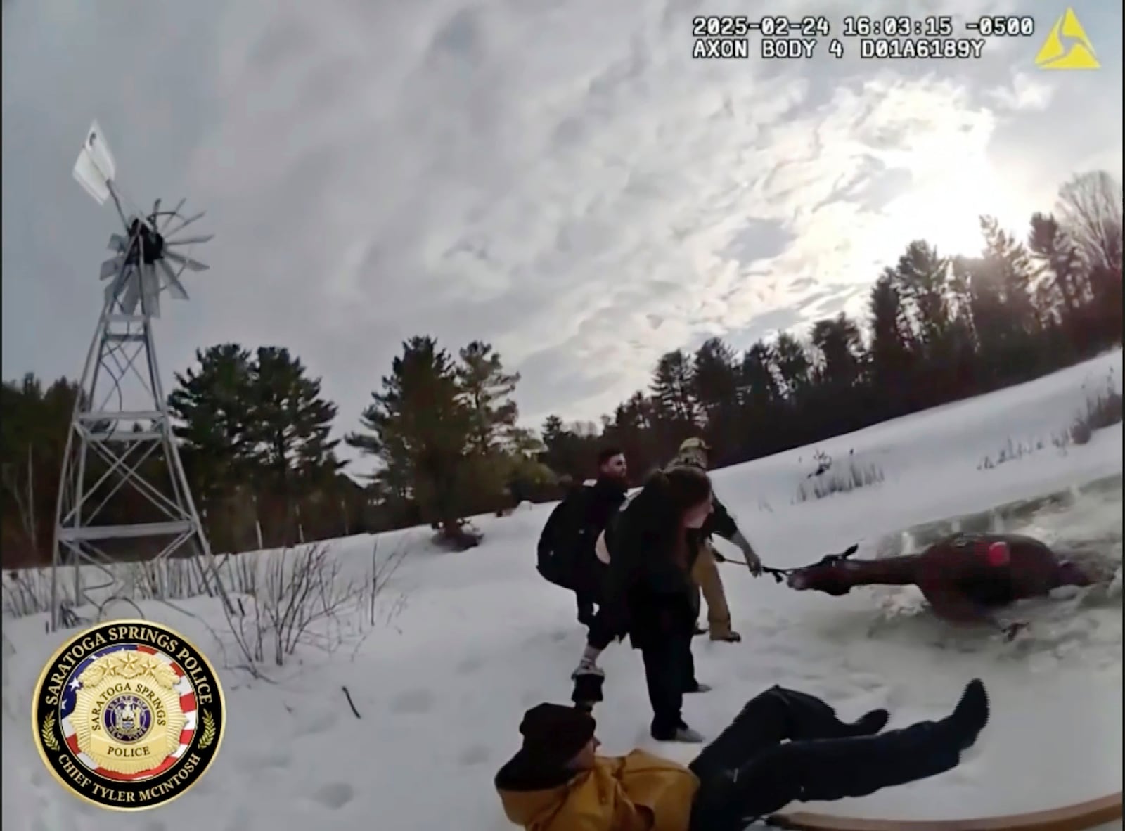 This image from body cam video, provided by Saratoga Springs Police, shows the rescue of Sly, a 1,300-pound horse that fell through ice of a pond in Saratoga Springs, N.Y., Monday, Feb. 24, 2025. (Saratoga Springs Police via AP)