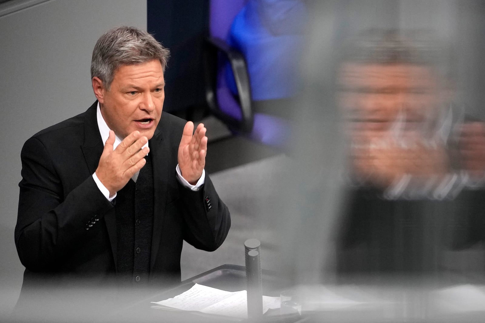 Economy and Climate Minister Robert Habeck speaks during a plenary session at the German parliament Bundestag where he faces a vote of confidence, Berlin, Germany, Monday, Dec. 16, 2024. (AP Photo/Markus Schreiber)